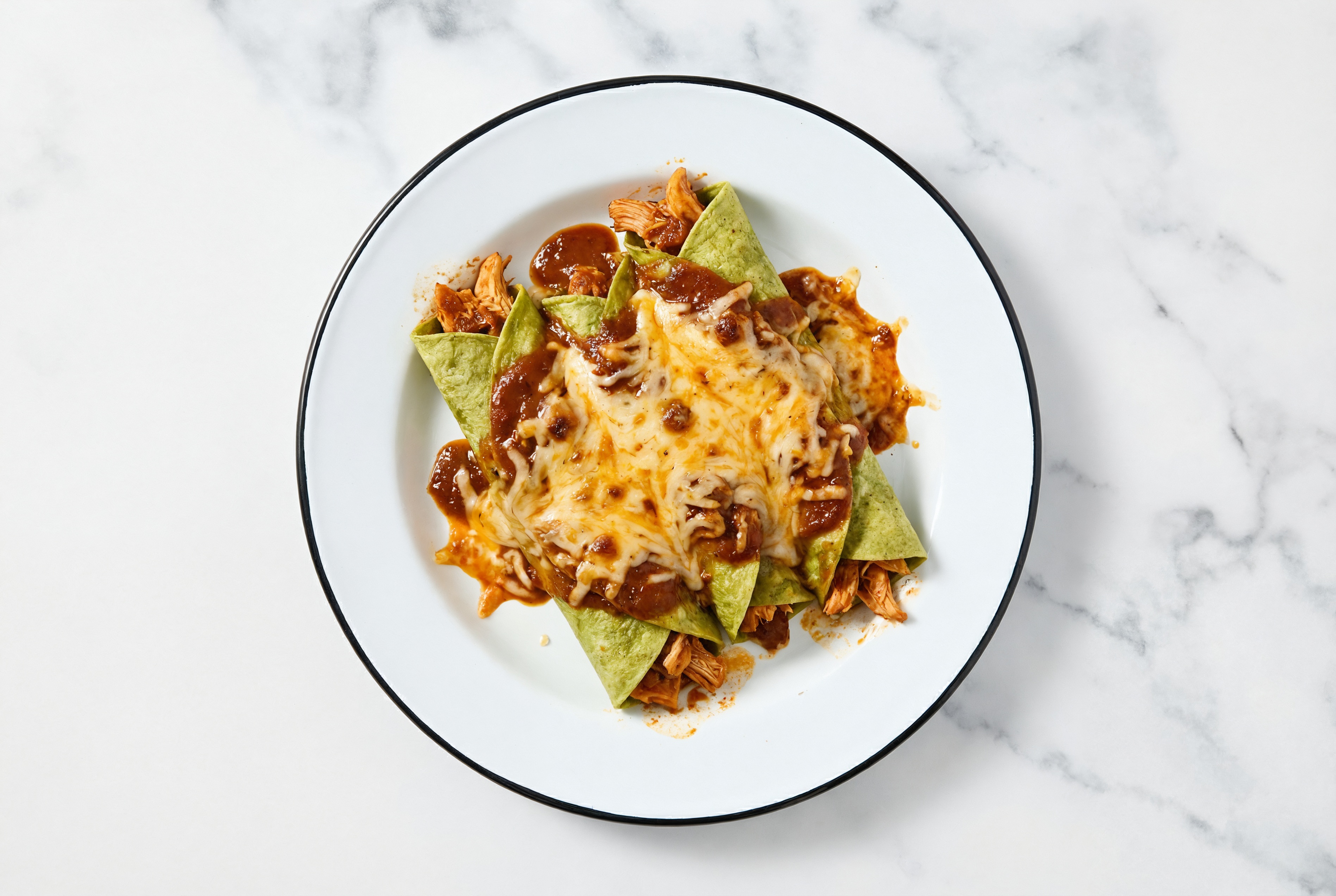Loaded Cheesy Pulled Chicken Enchiladas Rojas with Shredded Sharp Cheddar Cheese