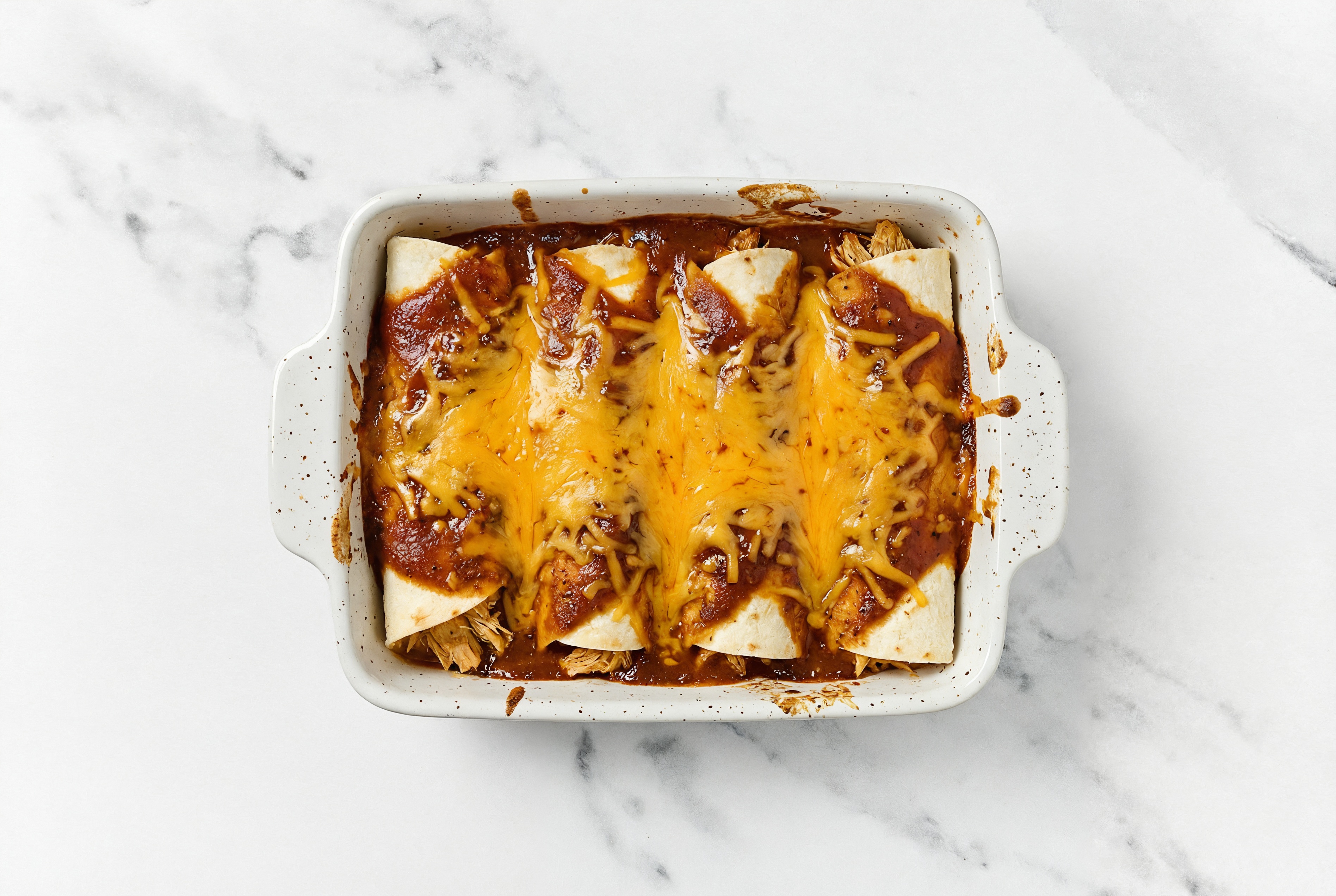 Savory Cheesy Chicken Enchiladas Rojas with Shredded Sharp Cheddar Cheese