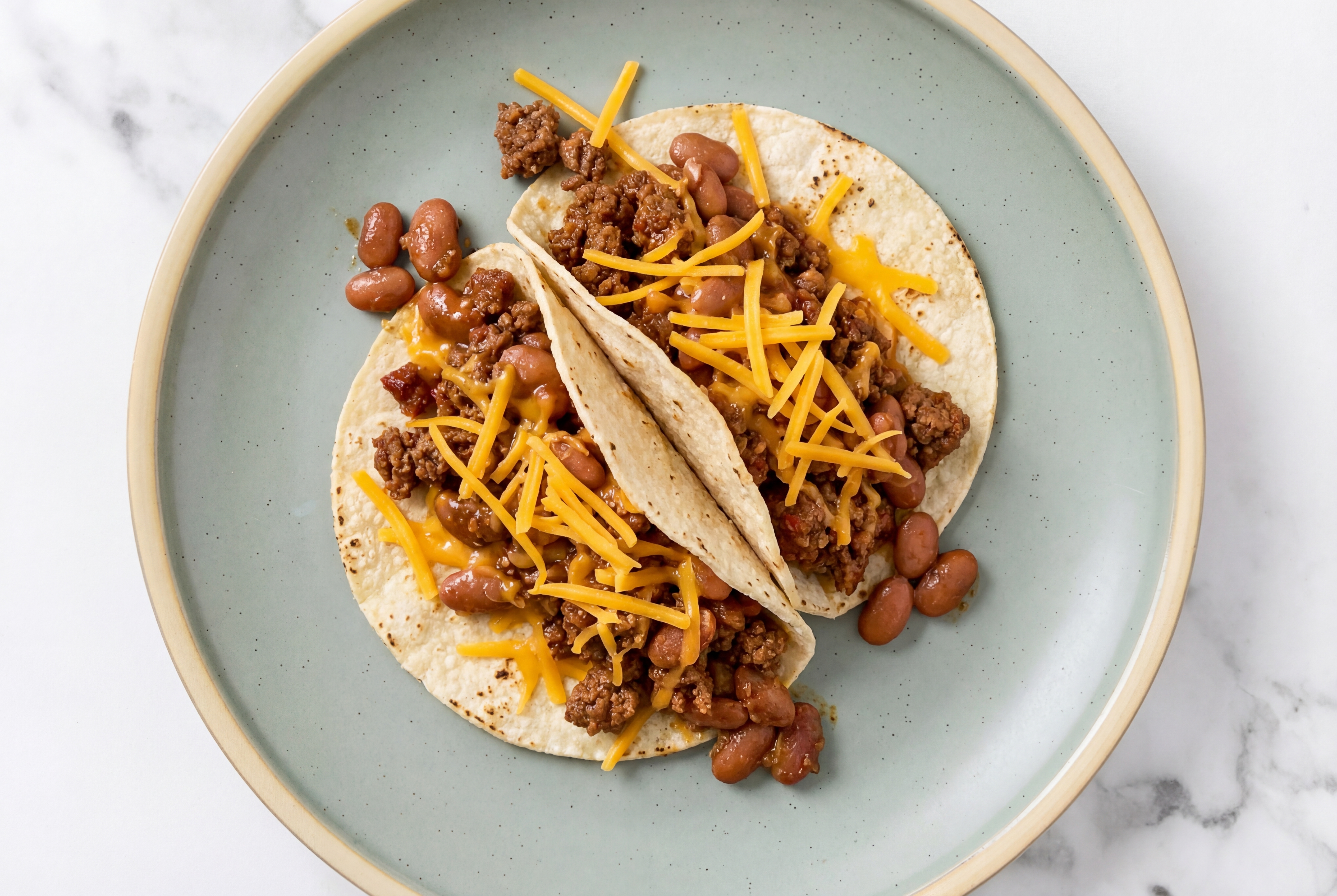 Hearty Mexican-Style Ground Beef Tacos with Cheddar Cheese & Pinto Beans
