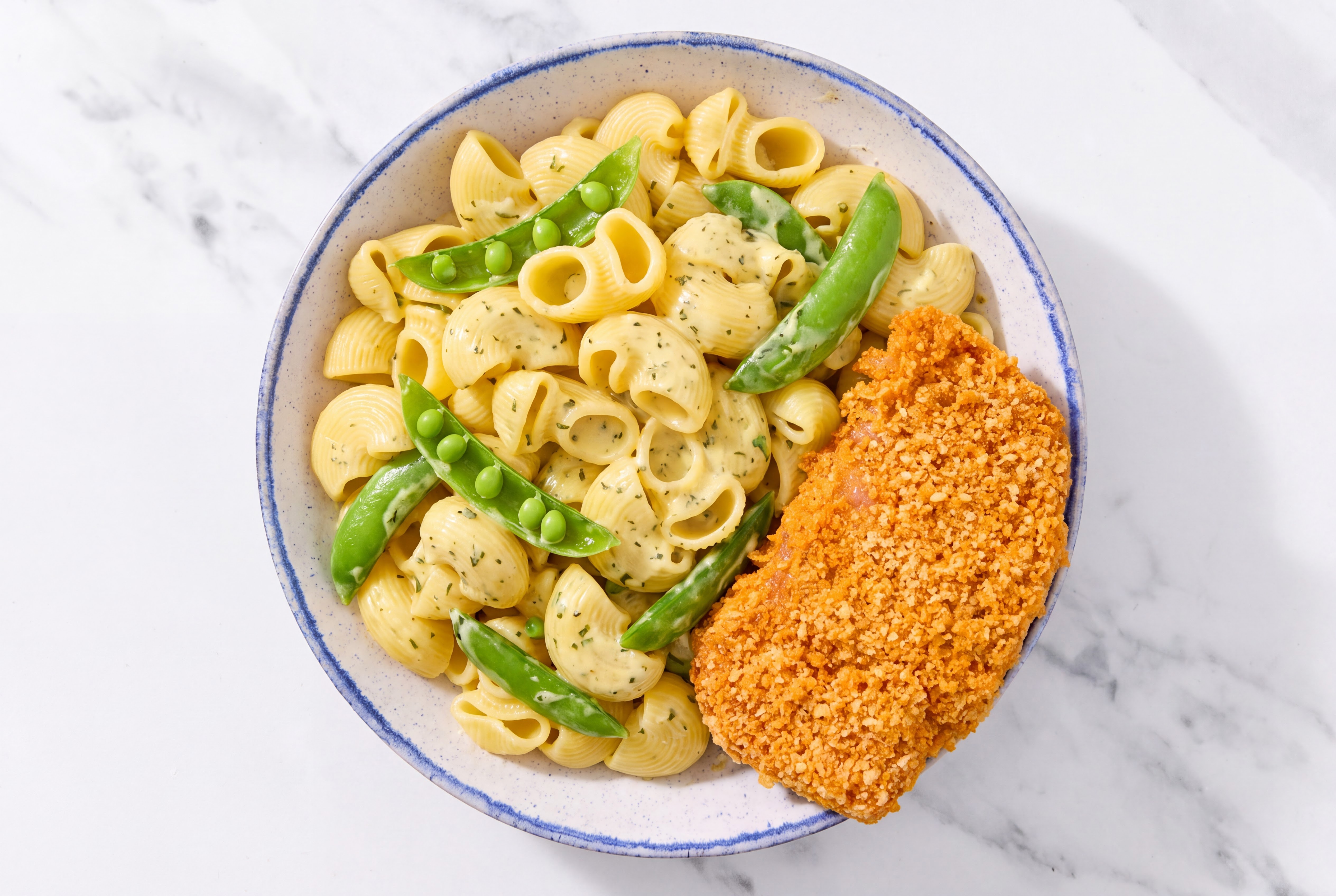 Crispy Hot Honey Chicken over Creamy Chiocciole Pasta with Snap Peas