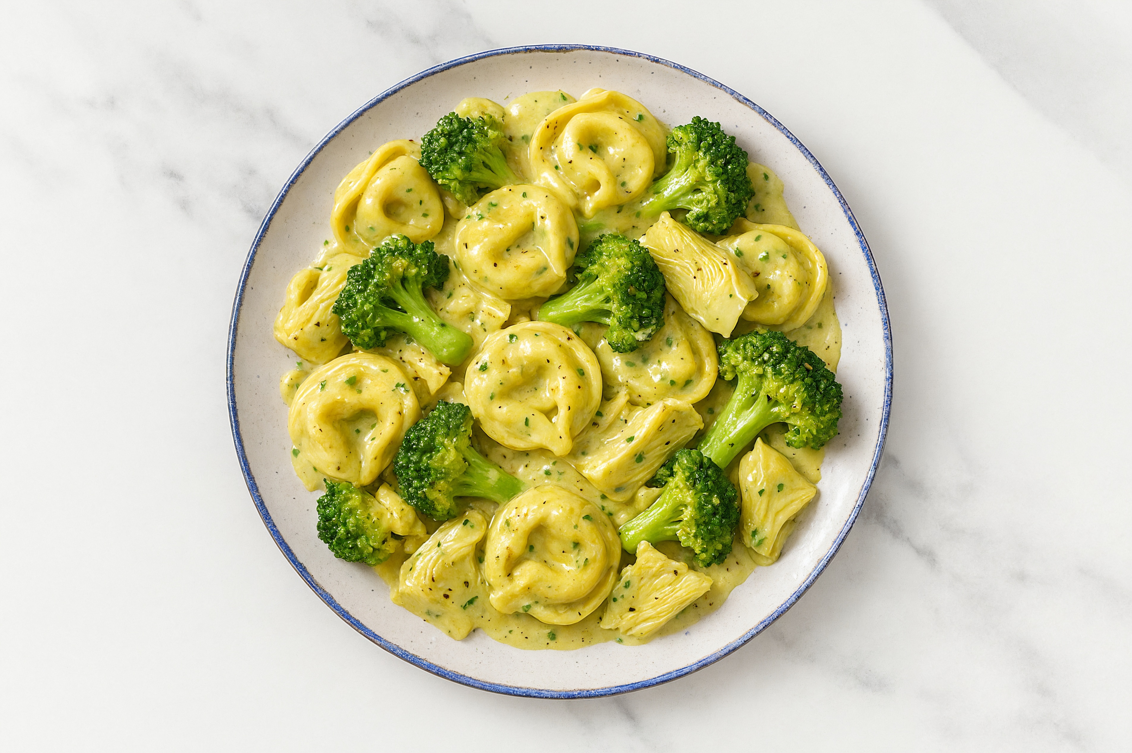 Veggie Antipasti Tortellini Herb Cream with Broccoli Florets