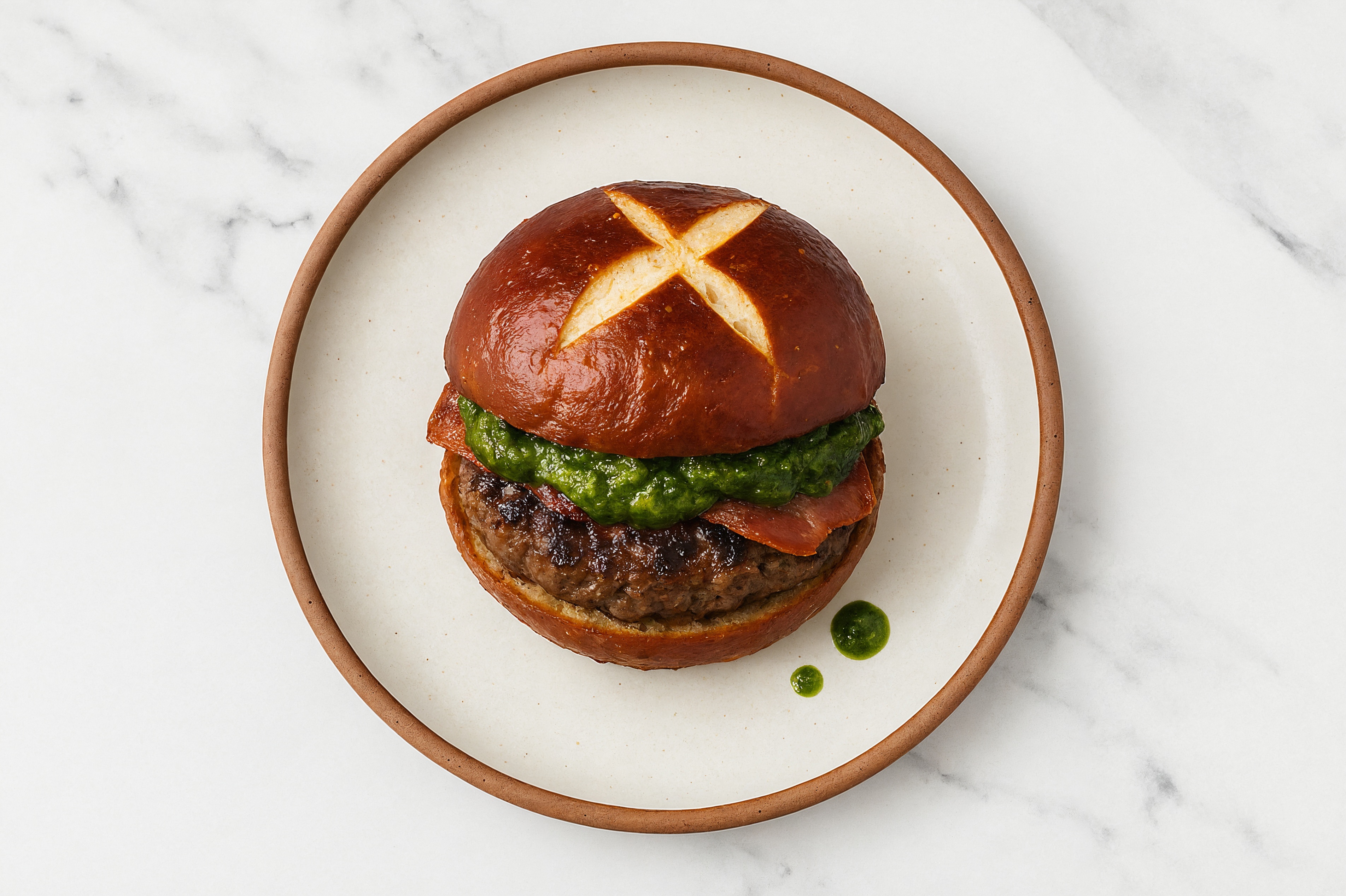 Bison Burger on Pretzel with Spinach Pesto & Turkey Bacon