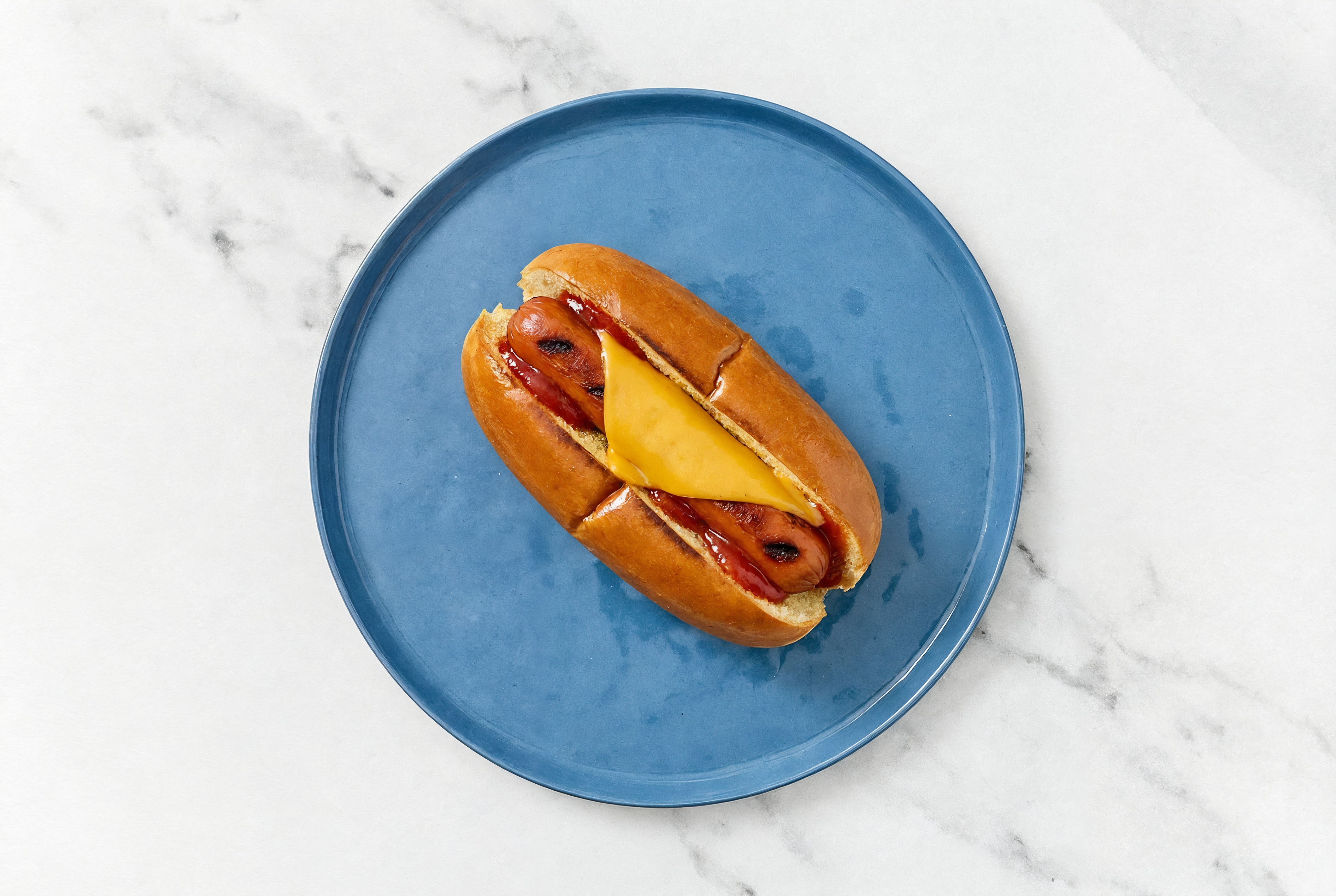 Cheddar Smart Dog with Ketchup on Brioche