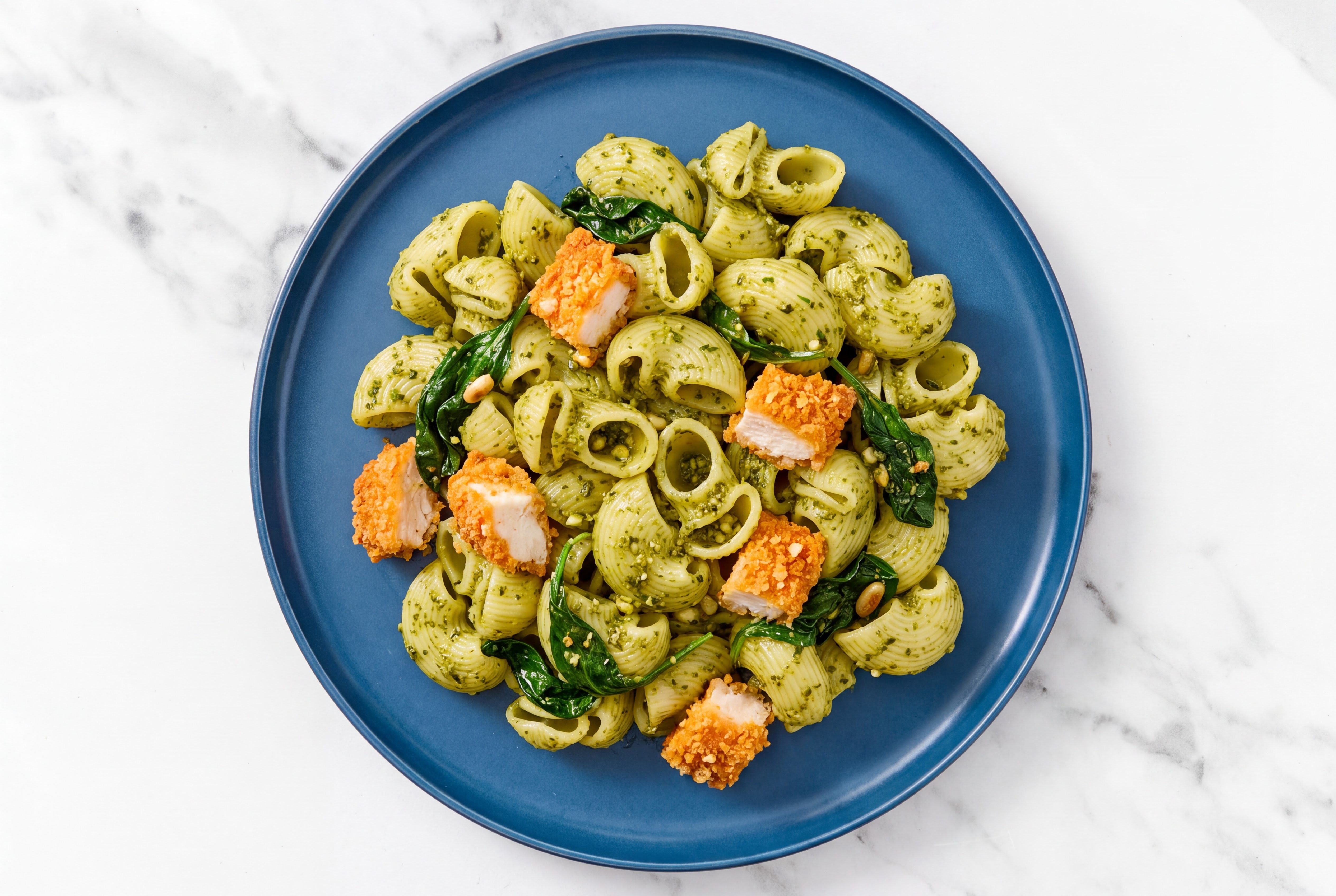 Crispy Hot Honey Chicken over Pesto Chiocciole Pasta with Baby Spinach