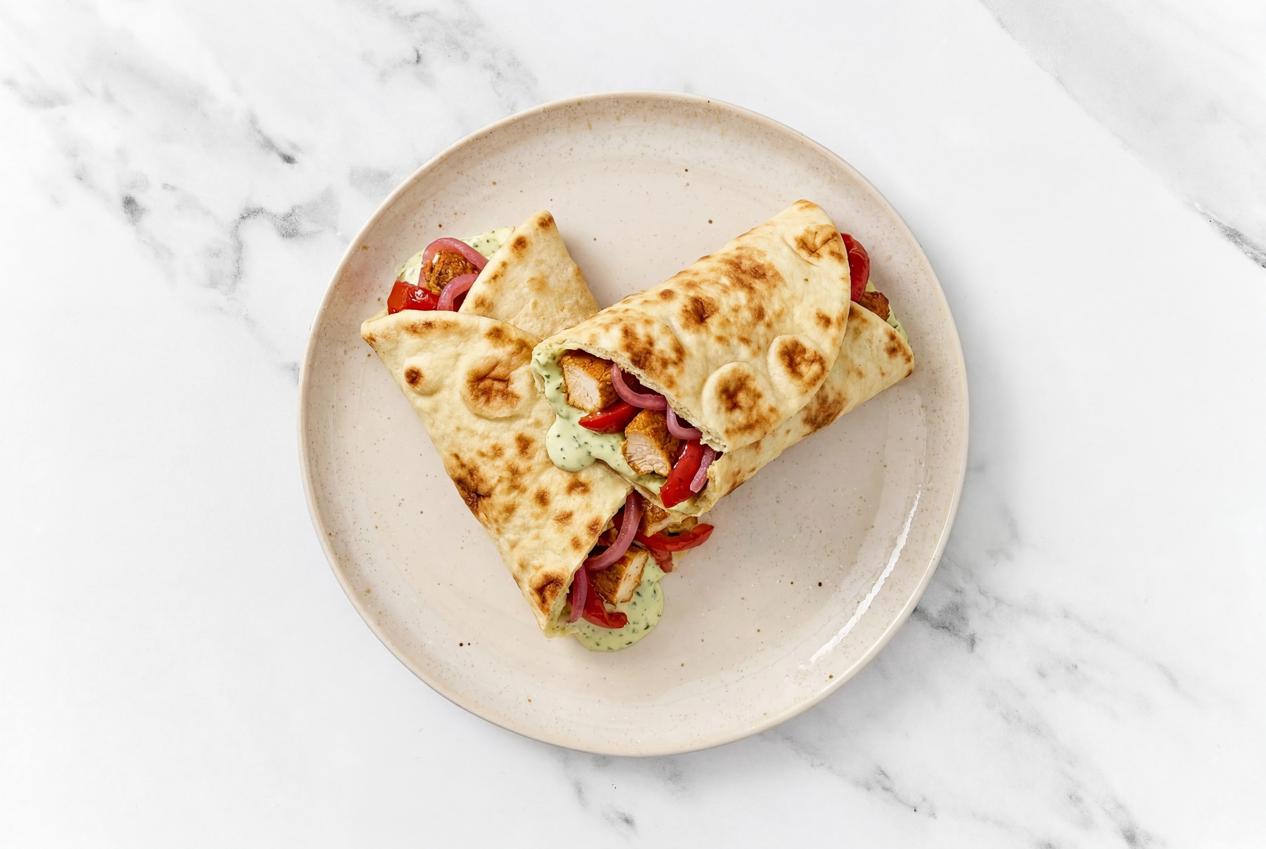 Tandoori Chicken Wrap with Jalapeño Crema + Pickled Onions