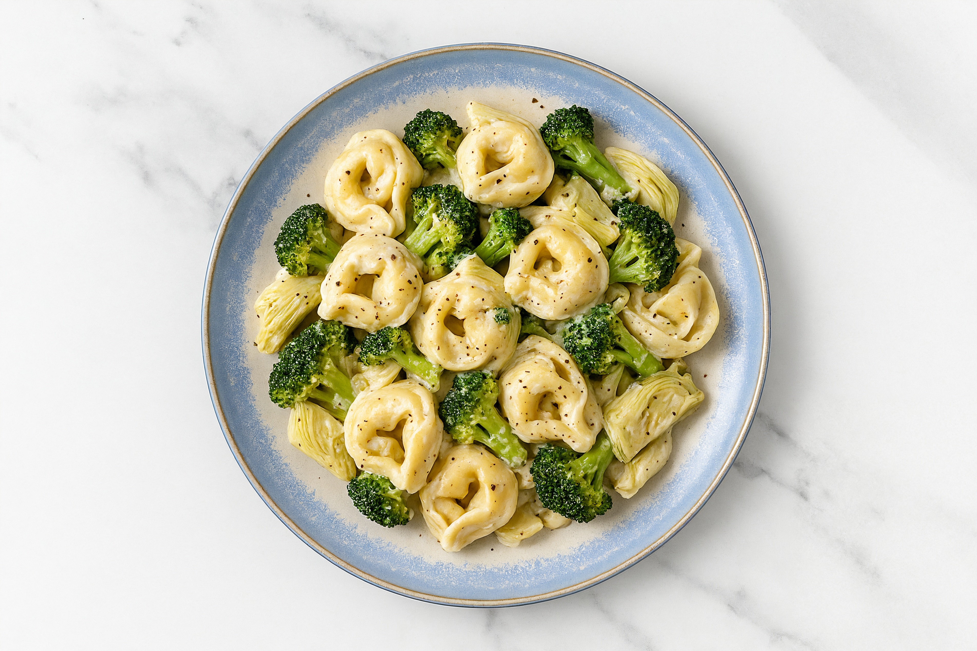 Herby Veggie Antipasti Tortelloni Alfredo with Broccoli Florets