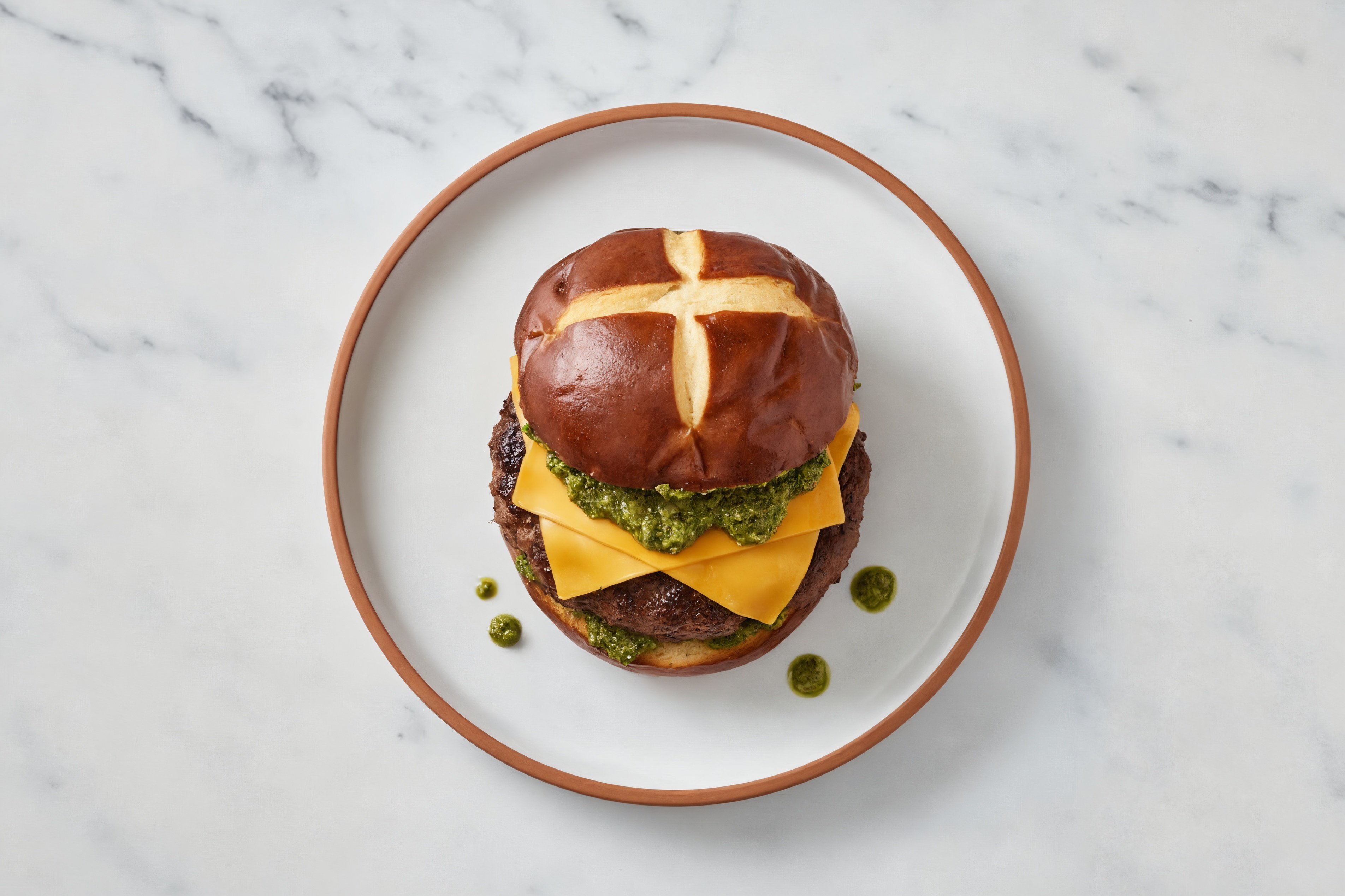 Bison Burger on Pretzel with Spinach Pesto & Gouda