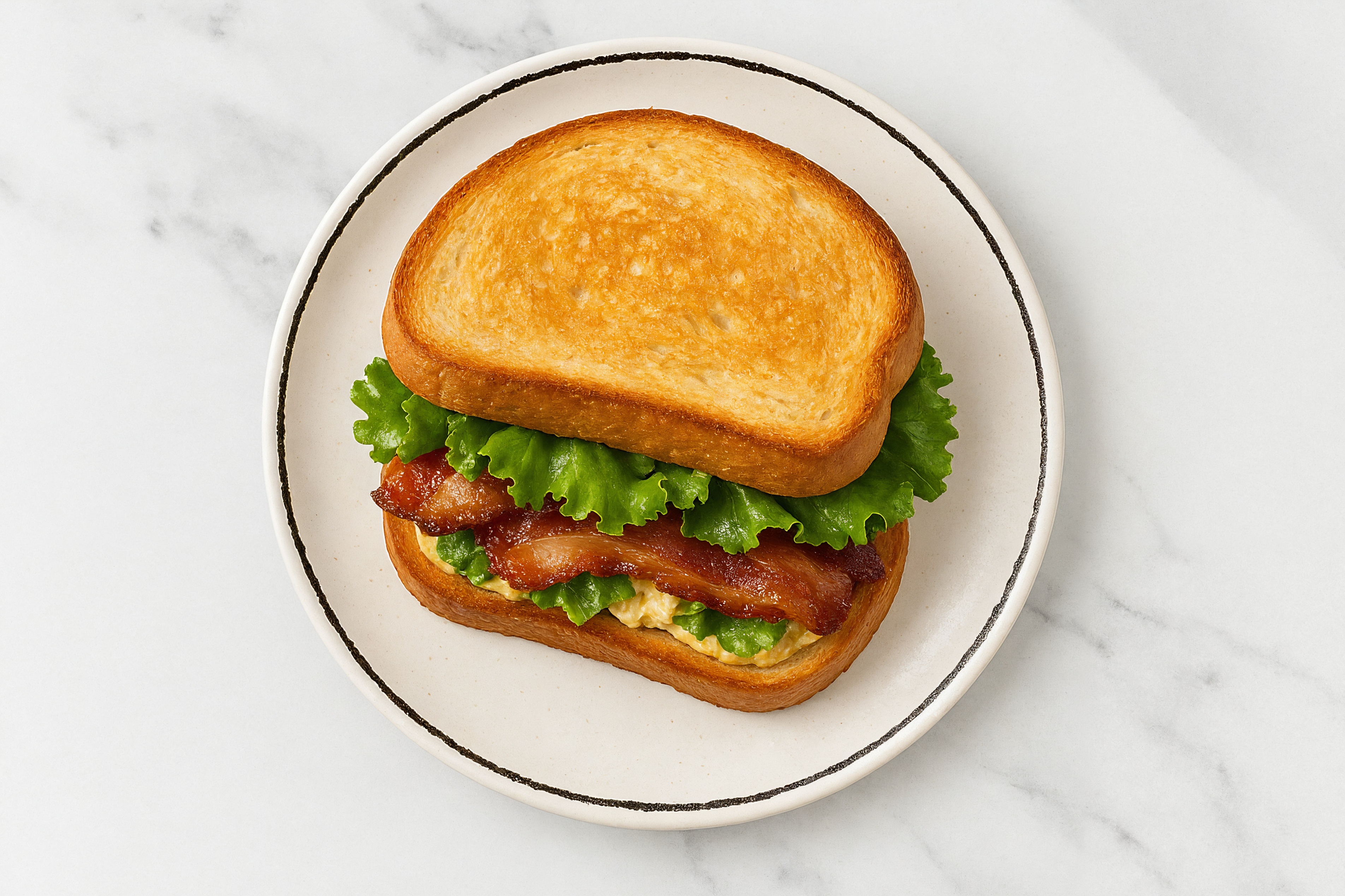 Street Corn Applewood Smoked Pork Bacon Sandwich with Green Leaf Lettuce on Honey White Bread