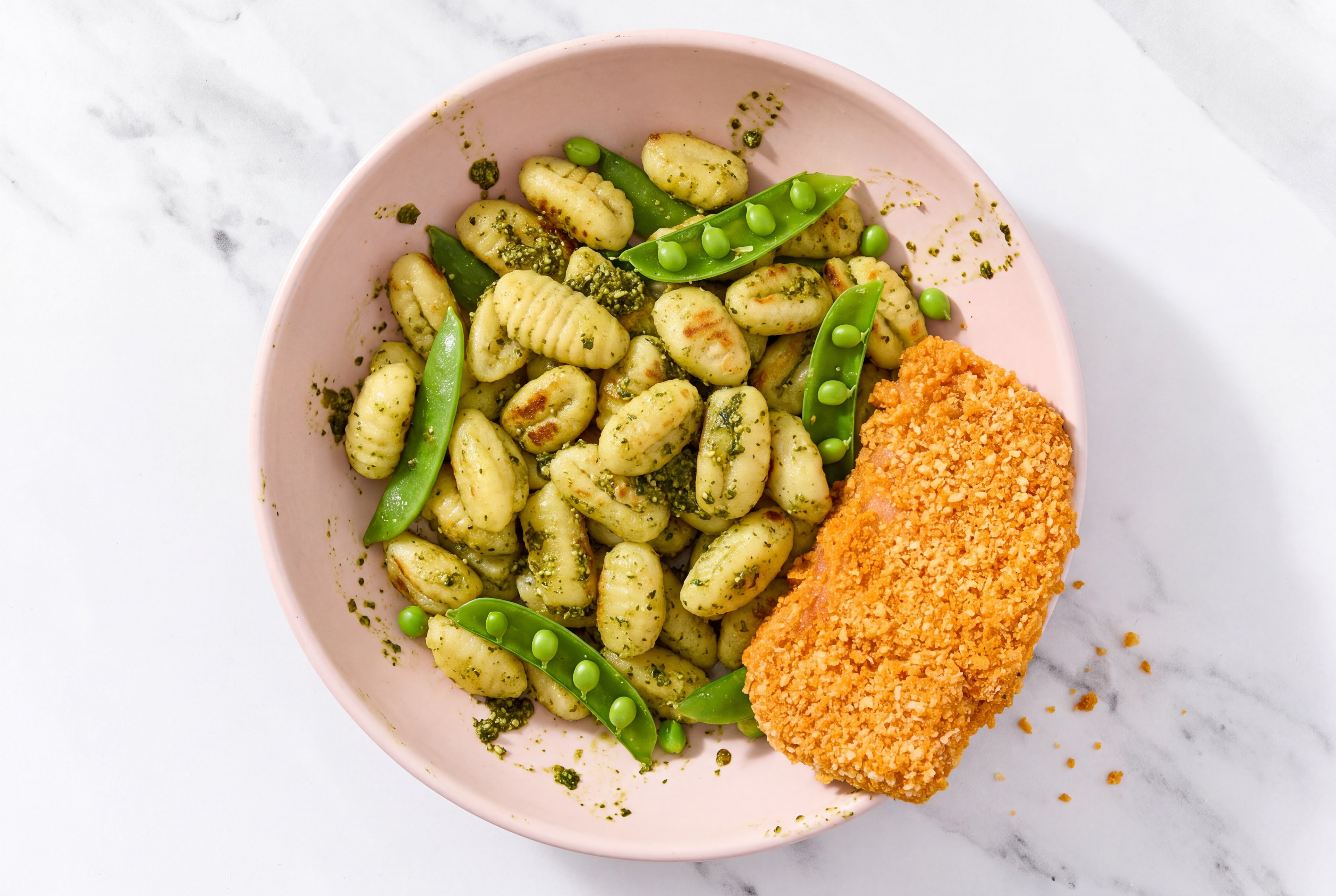 Crispy Hot Honey Chicken over Pesto Gnocchi with Snap Peas