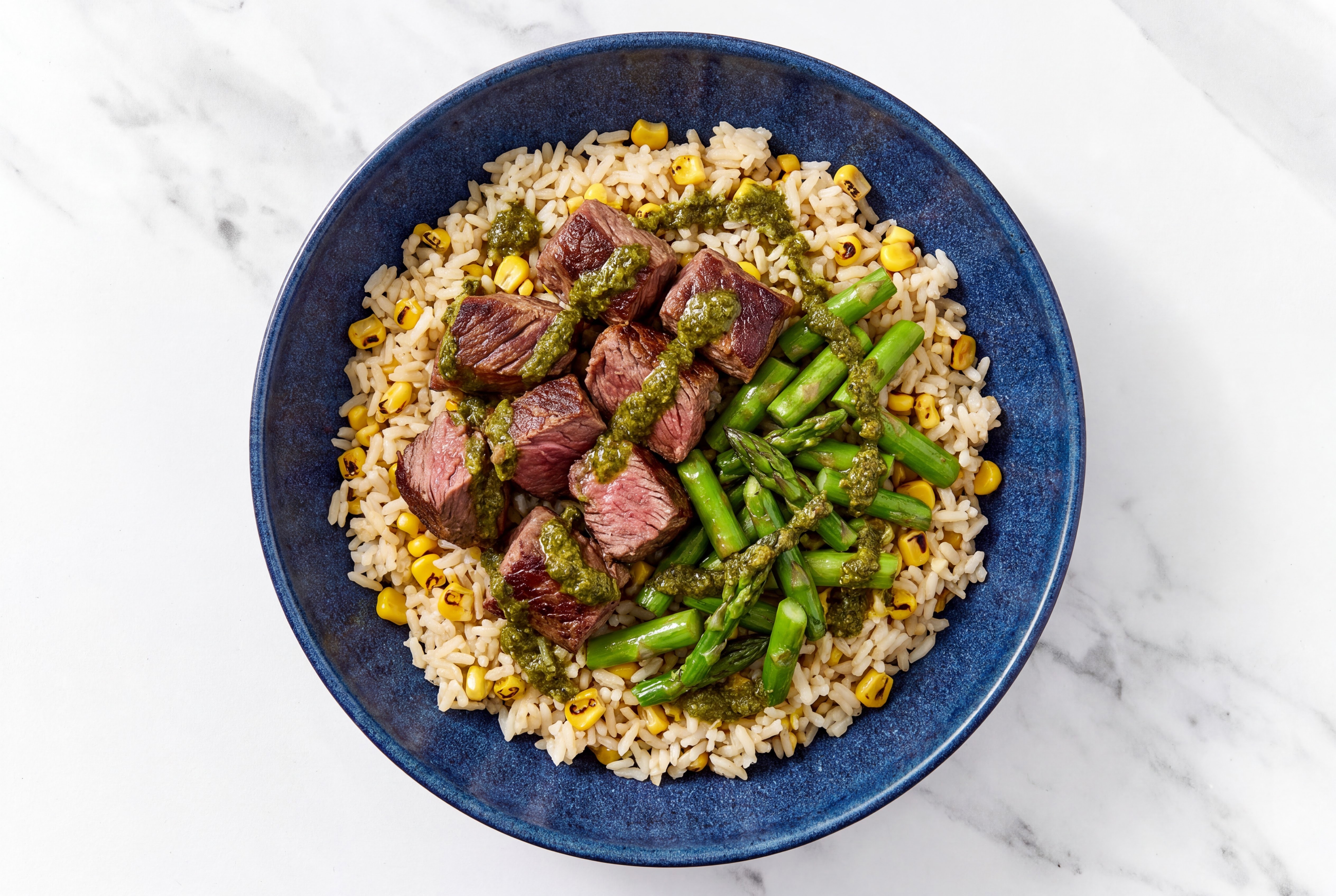Zhoug Seared Lamb + Corn Rice Bowl with Baby Asparagus