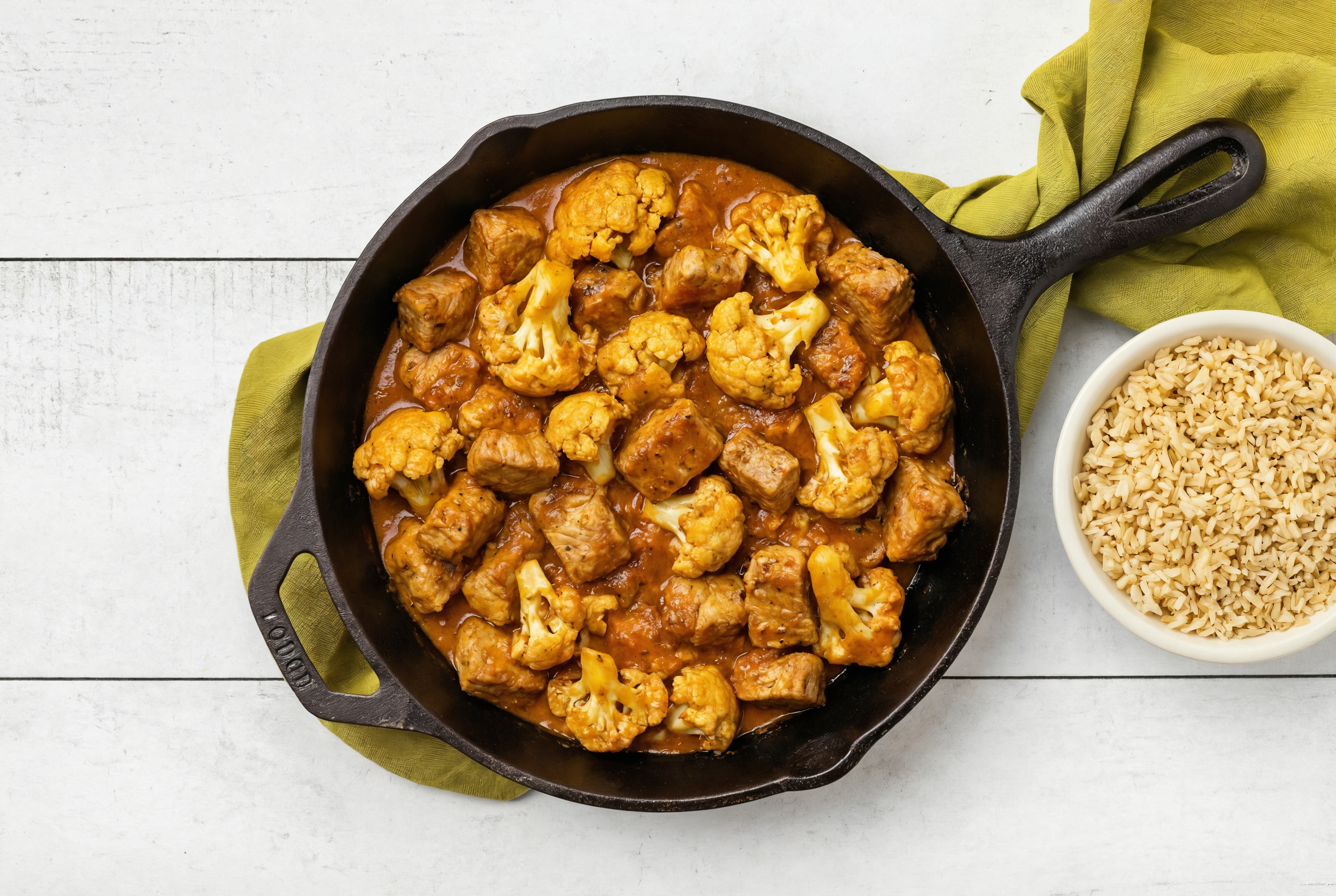 Tikka Masala Pork Chop Stir-Fry with Cauliflower Florets over Brown Rice