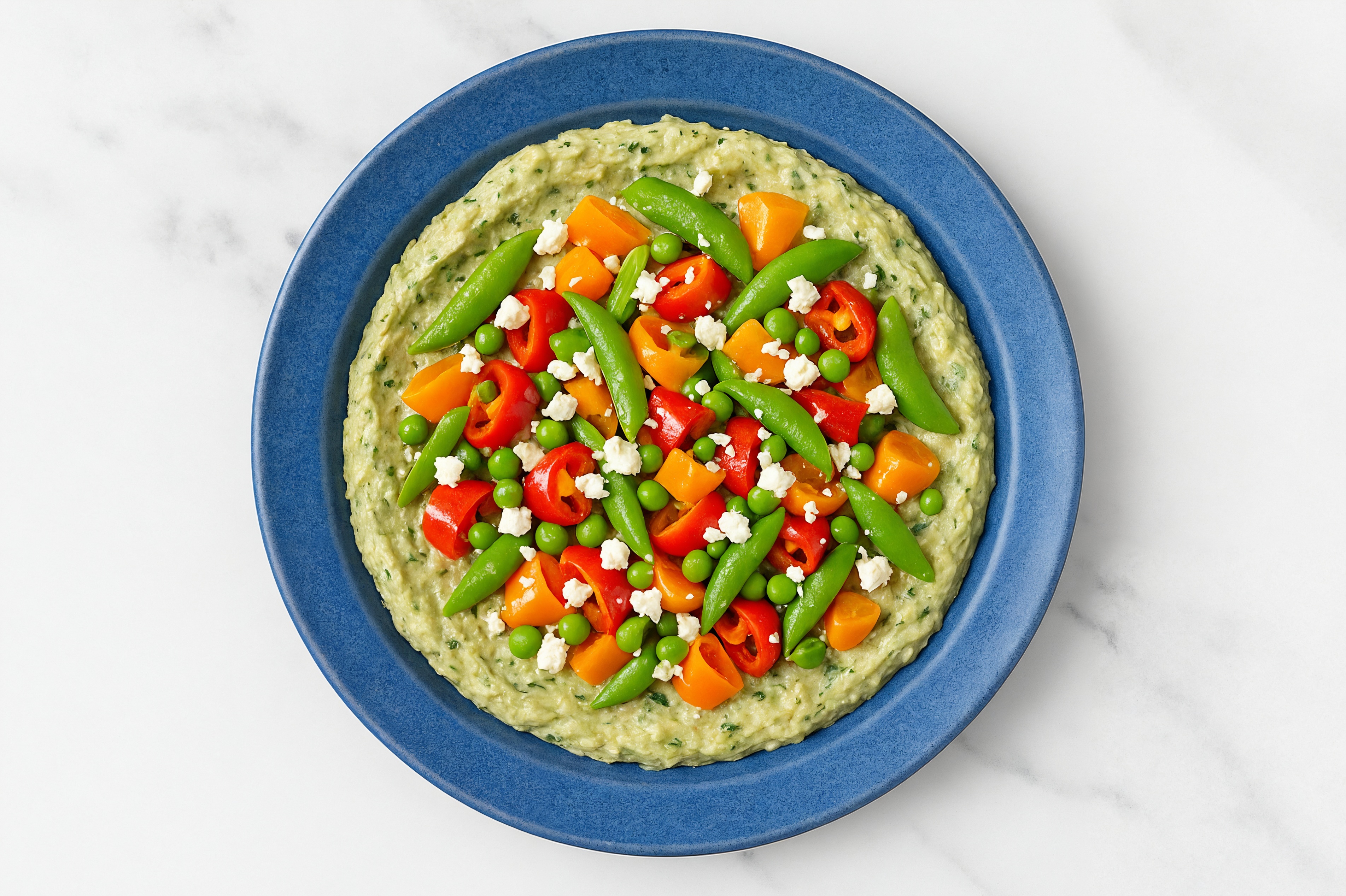 Crumbled Chevre Sweet Pepper Snap Pea Bowl over Spinach Artichoke Dip