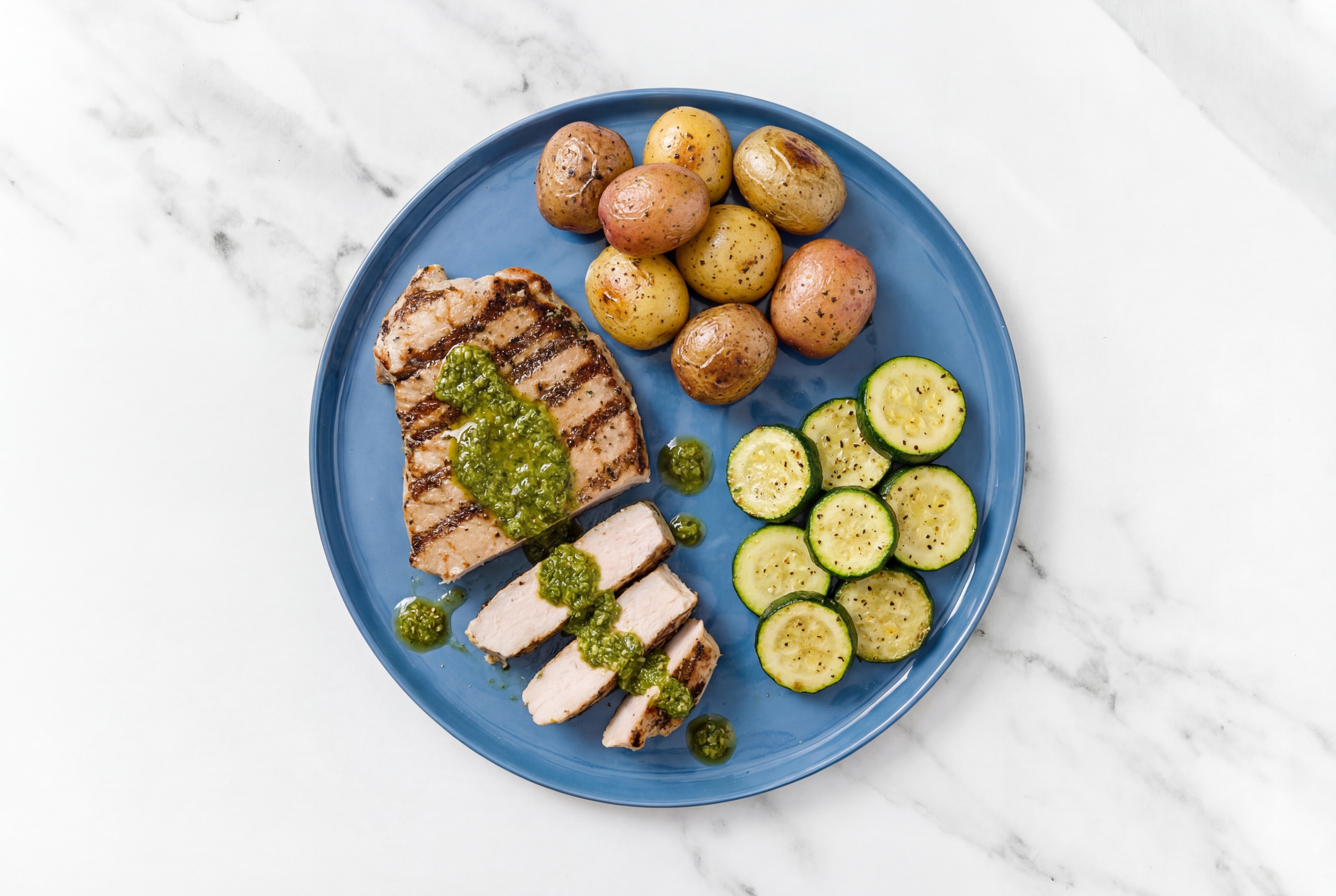 Herby Chimichurri Pork Chops + Roasted Potatoes with Zucchini