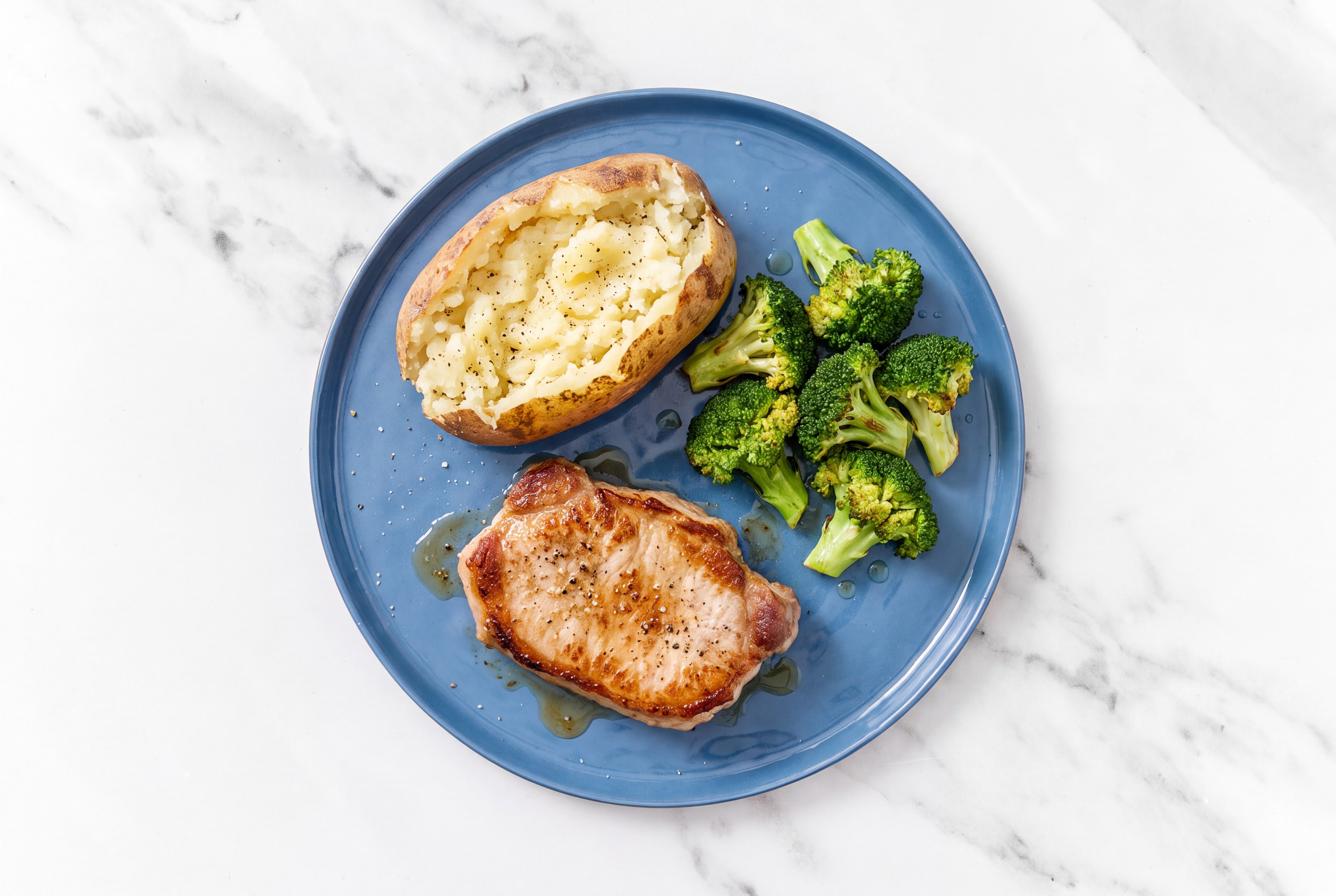 Seared Pork Chop with Baked Potato + Broccoli