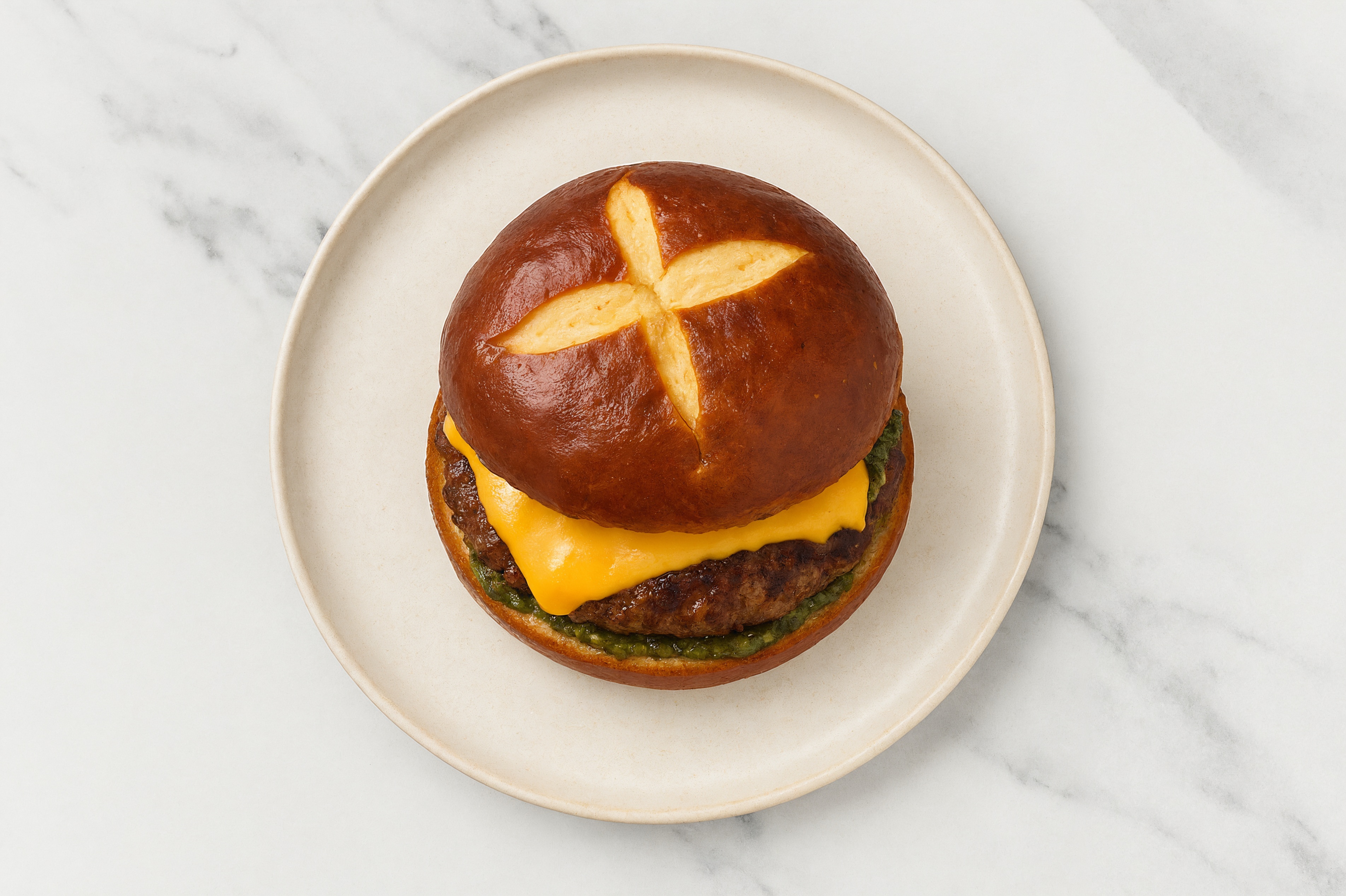 Bison Burger on Pretzel with Spinach Pesto & American