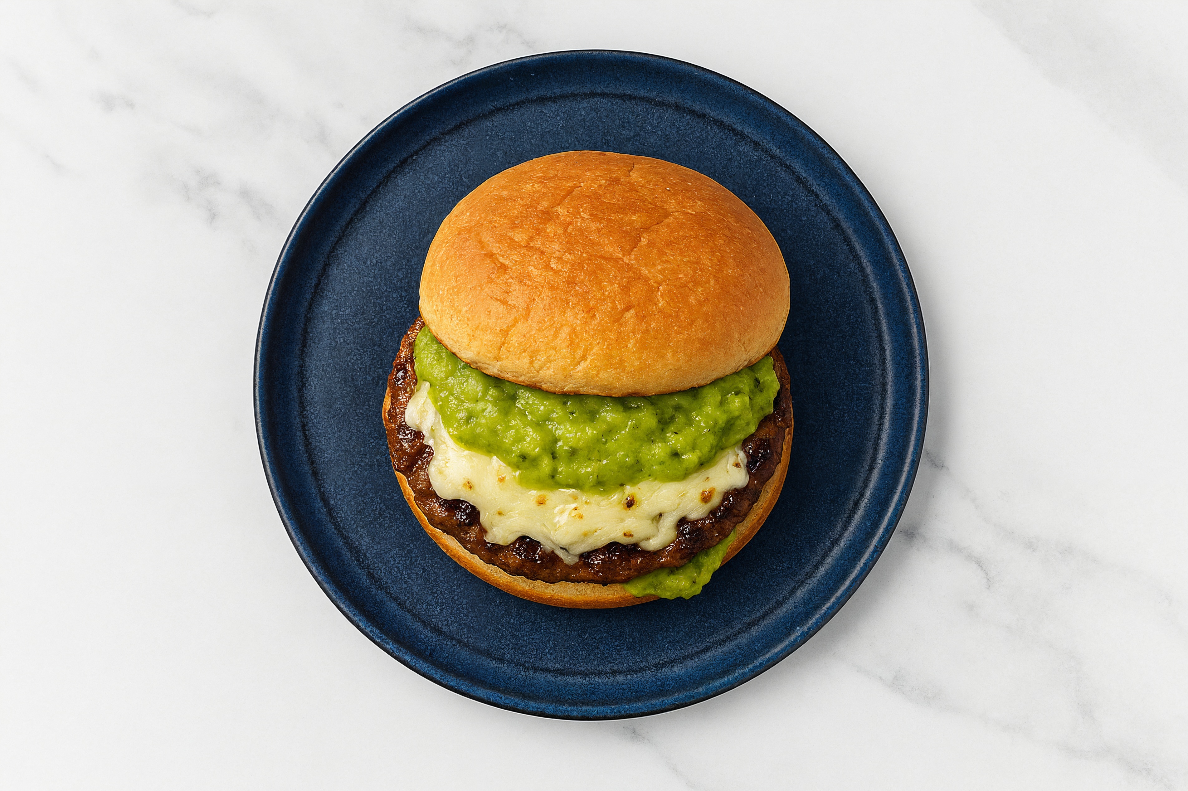 Mozzarella Tavern Beef Burger on GF Bun with Guacamole
