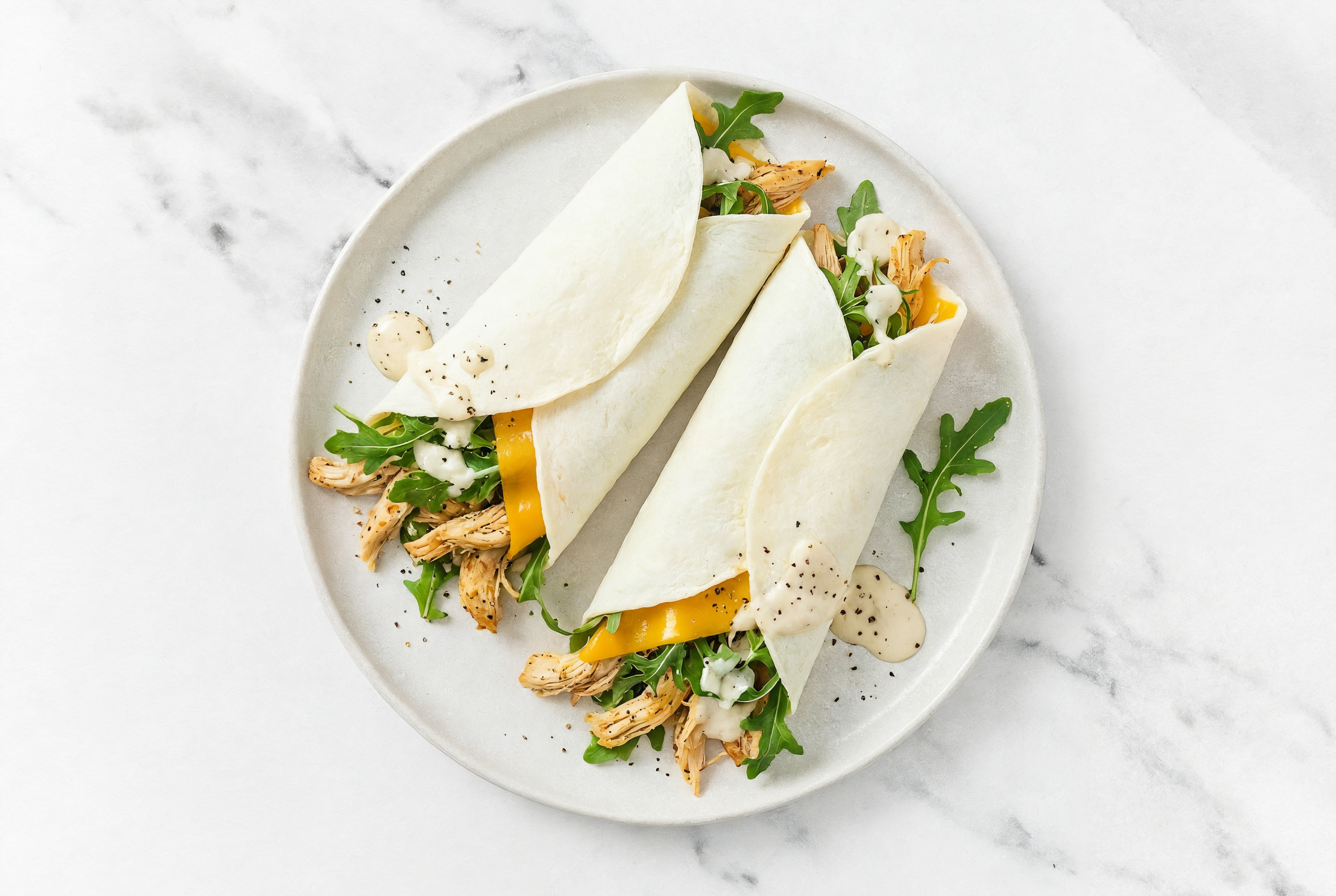 Garlic Pulled Chicken + Cheddar Wraps with Arugula