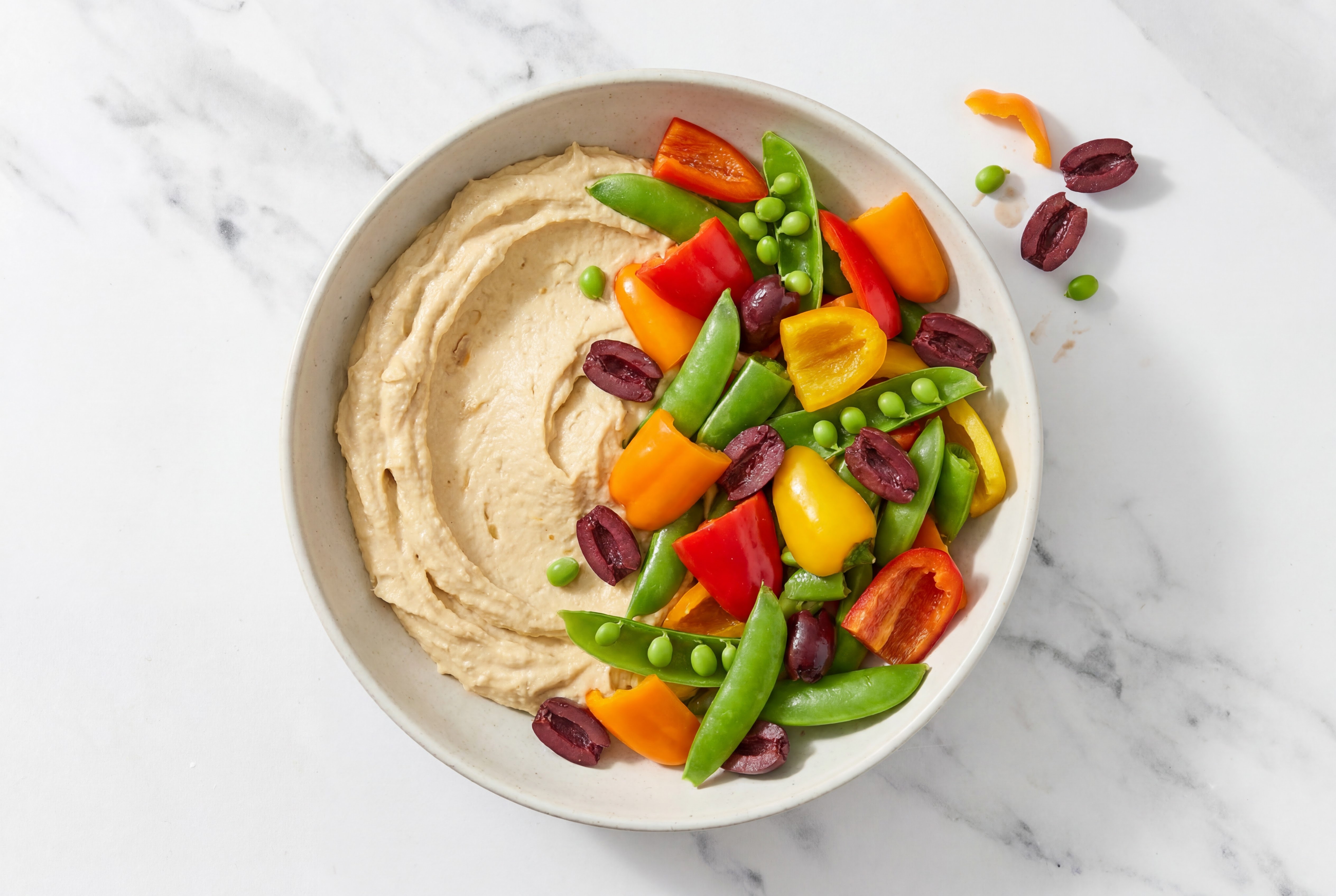 Olive Sweet Pepper Snap Pea Bowl over Onion Hummus