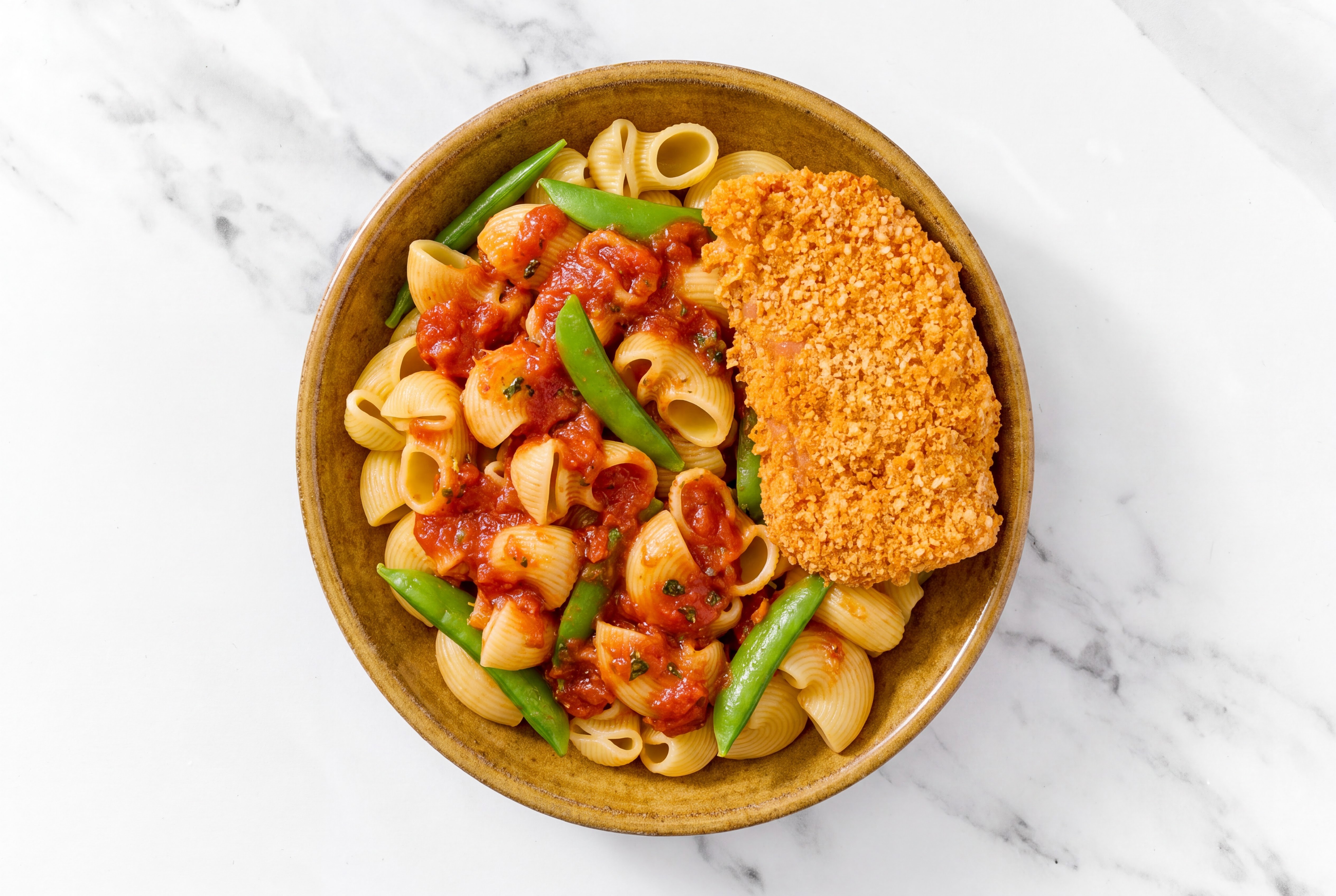Crispy Hot Honey Chicken over Marinara Chiocciole Pasta with Snap Peas