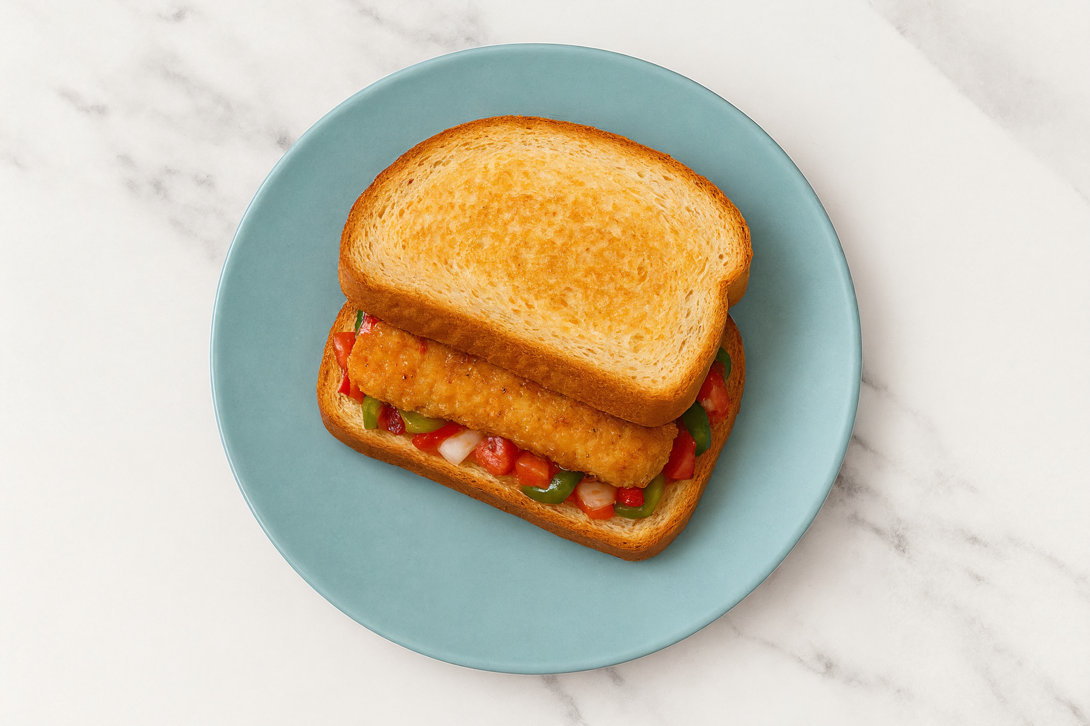 Mexican "Chicken" Tenders Sandwich with Peppers + Onion on Honey White Bread