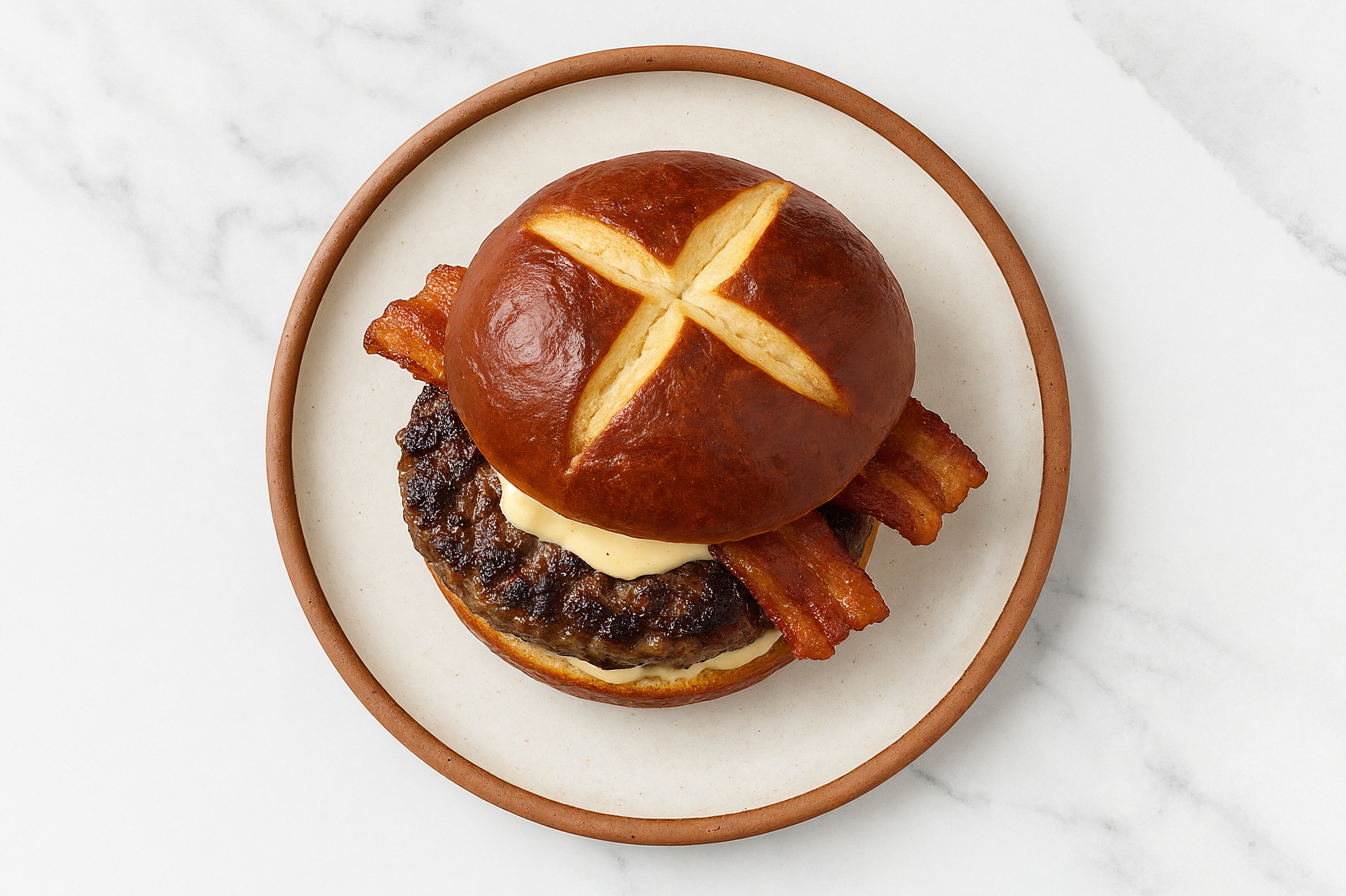 Beef Burger on Pretzel with Horseradish & Applewood Smoked Pork Bacon