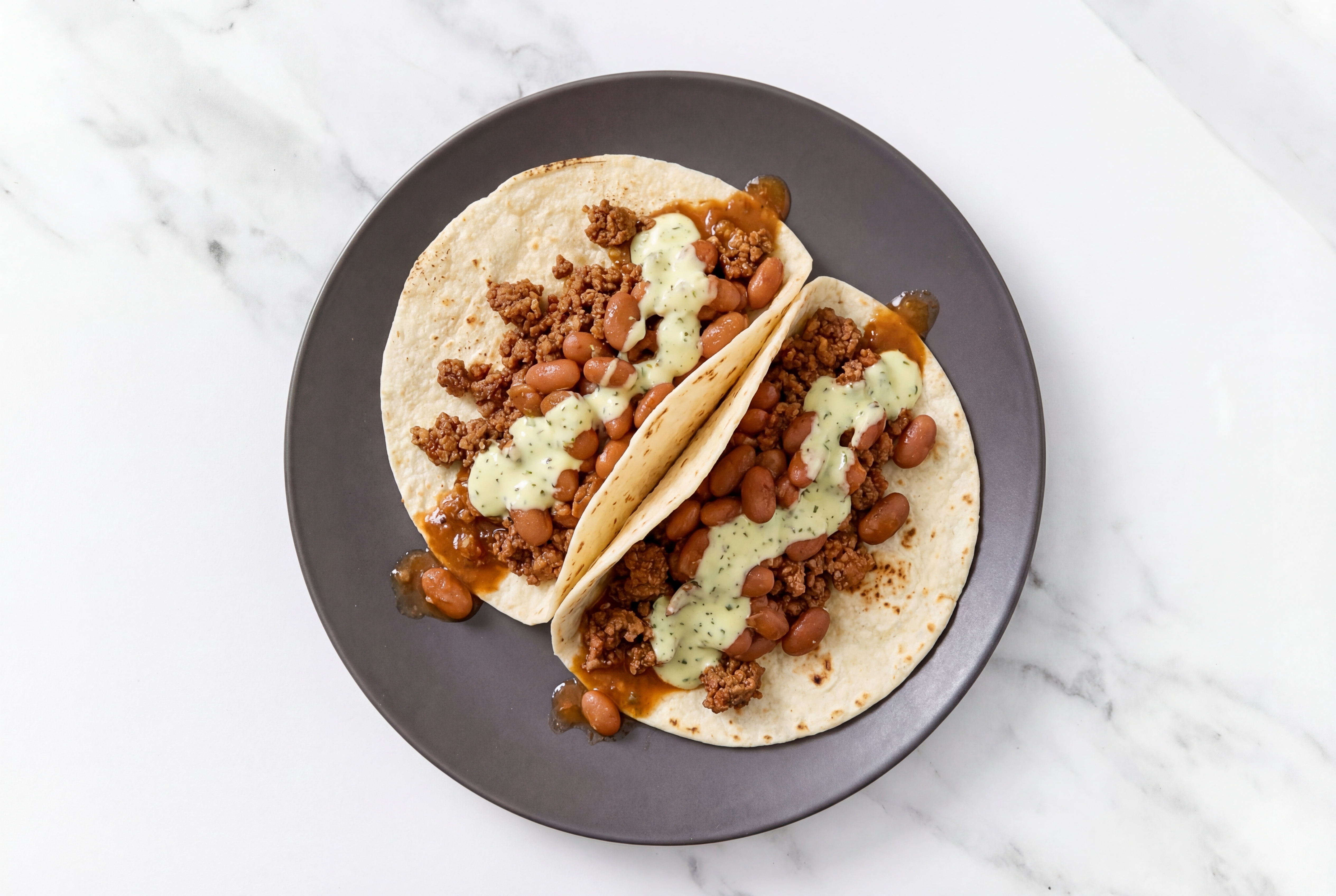 Mexican-Style Ground Beef Tacos with Jalapeño Crema & Pinto Beans