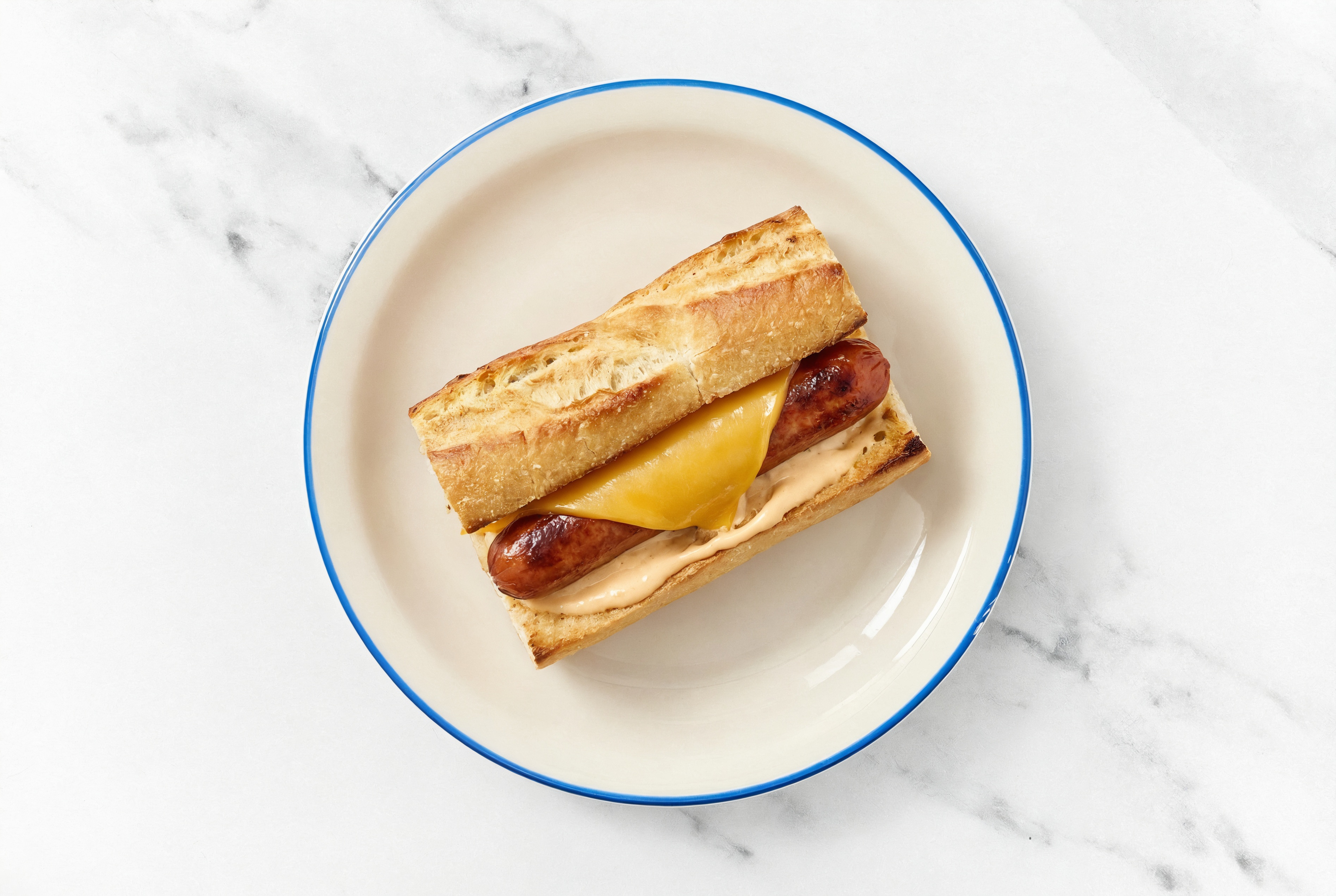 Cheddar Beef Hot Dog with Awesome Sauce on Baguette