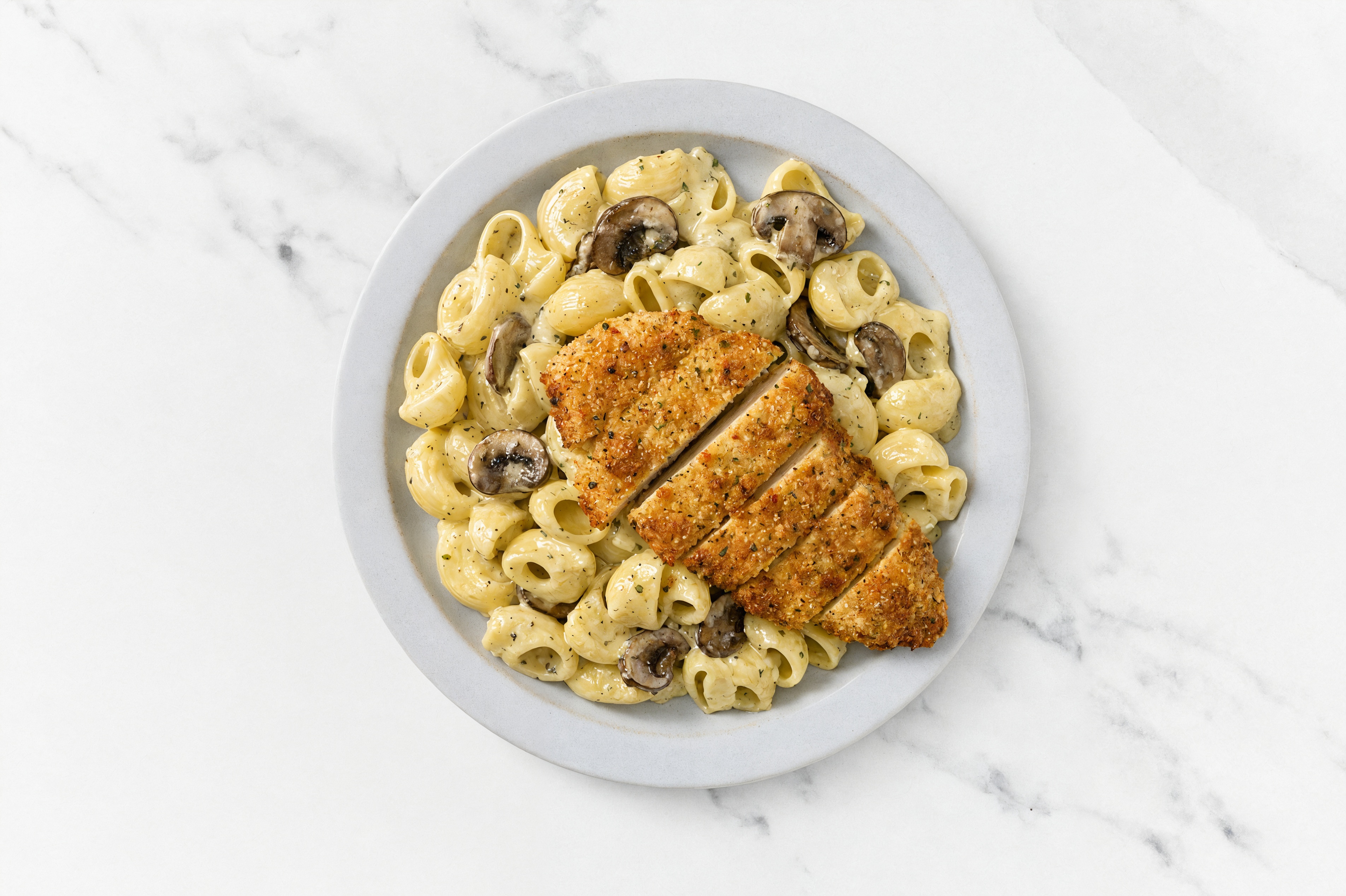Crispy Garlic Chicken over Creamy Chiocciole Pasta with Baby Bella Mushrooms
