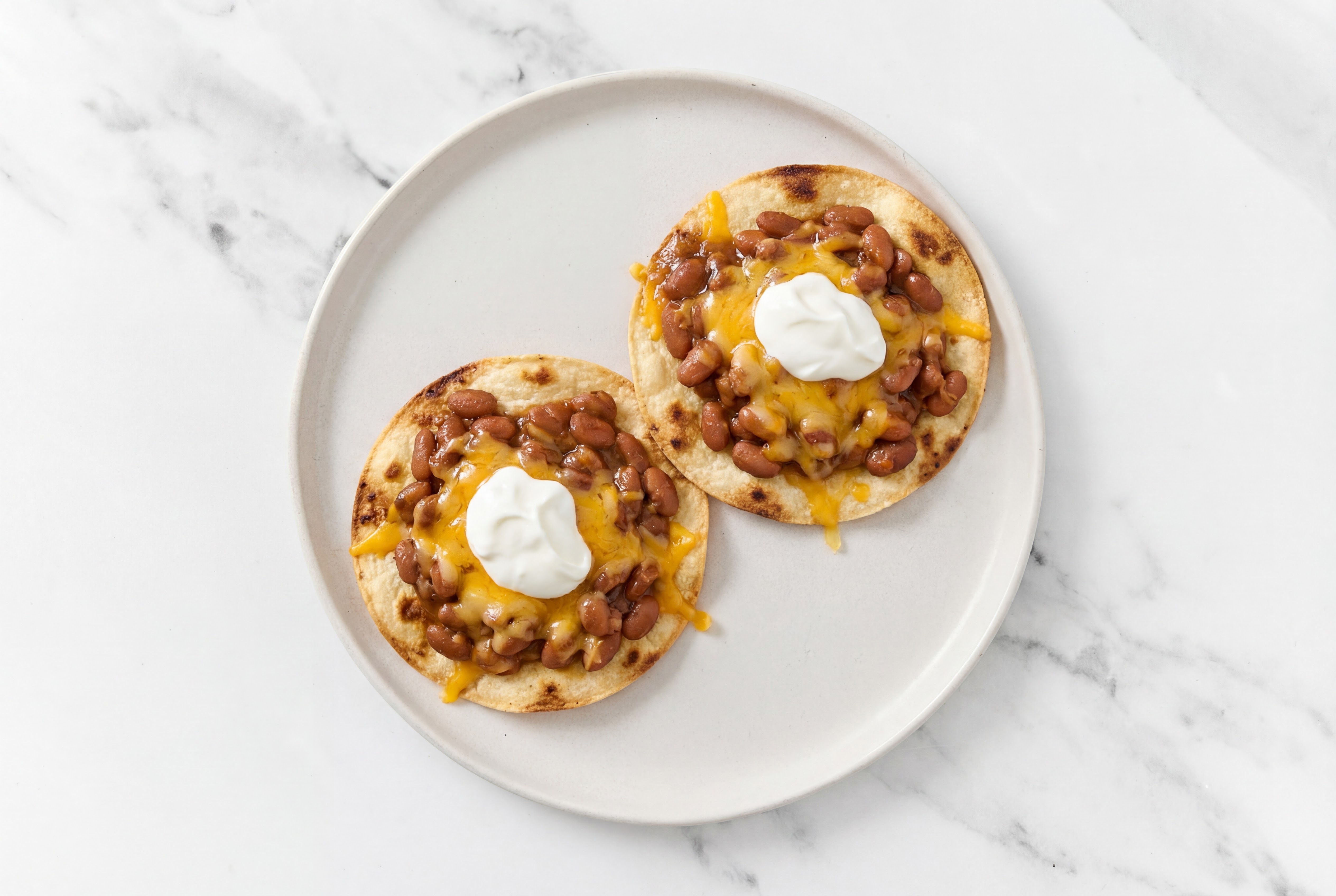Cheesy Pinto Bean Tostadas with Sharp Cheddar Bar