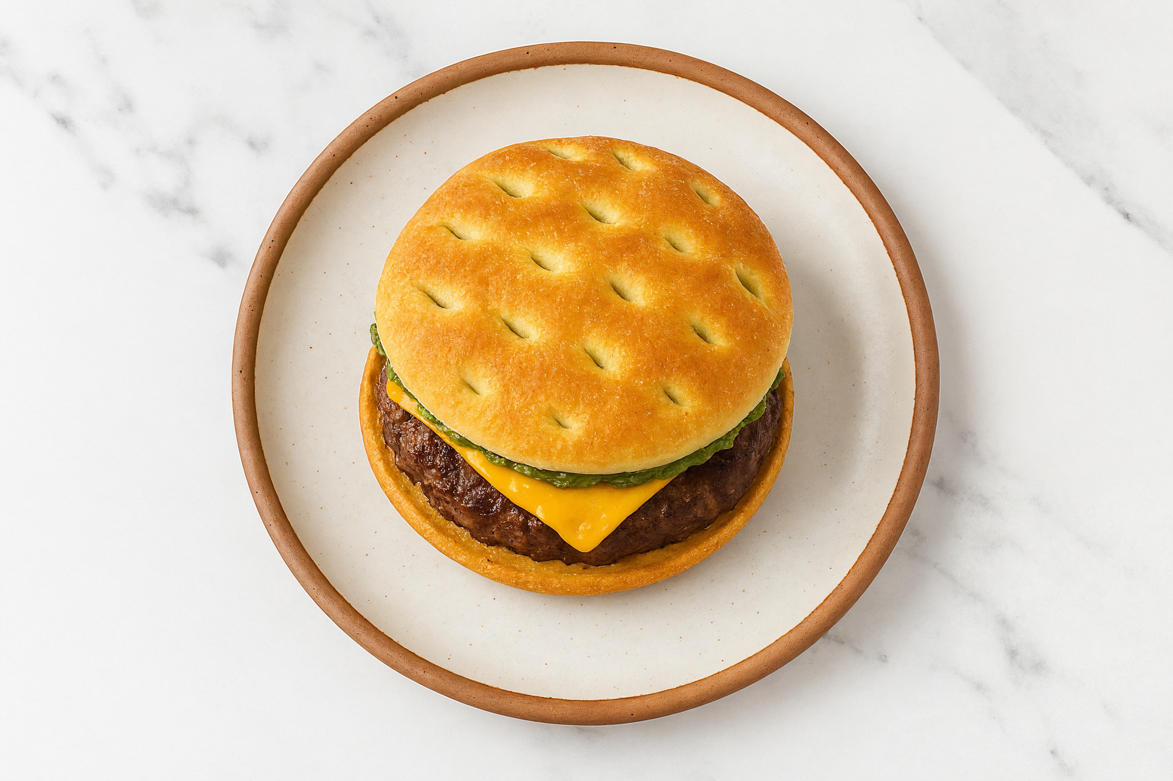 Bison Burger on Brioche with Pesto & Cheddar