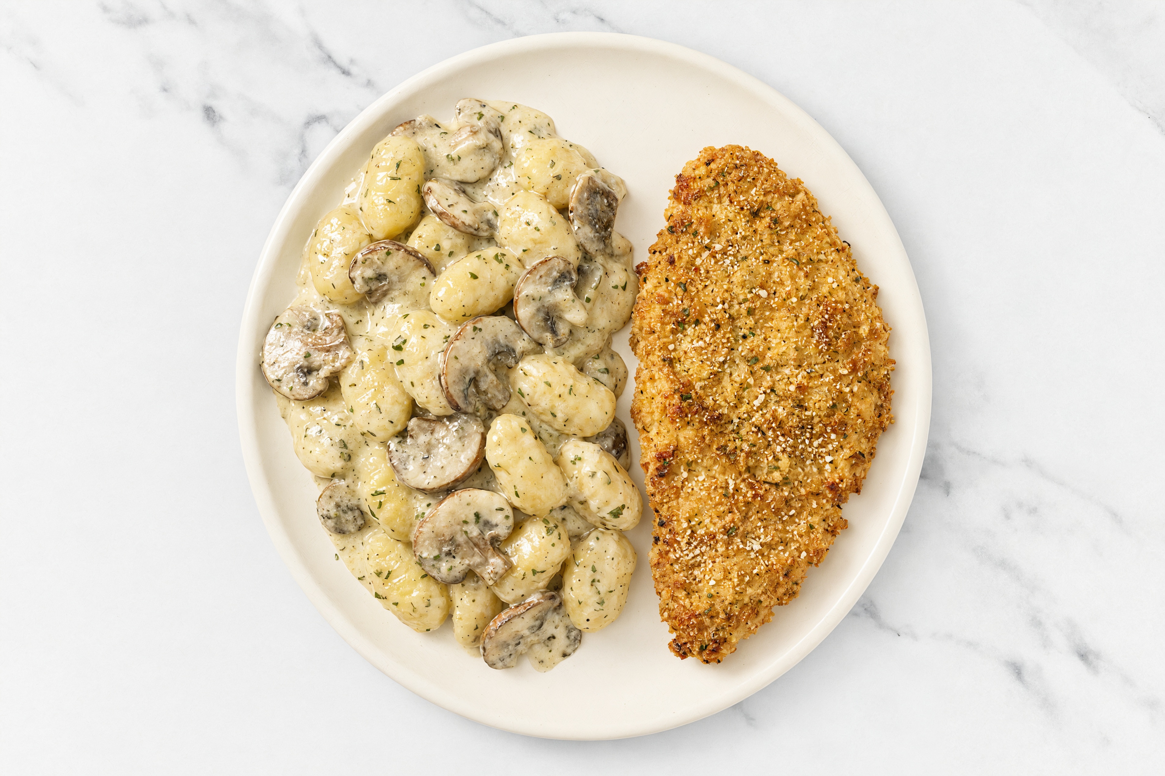 Crispy Garlic Chicken over Creamy Gnocchi with Baby Bella Mushrooms