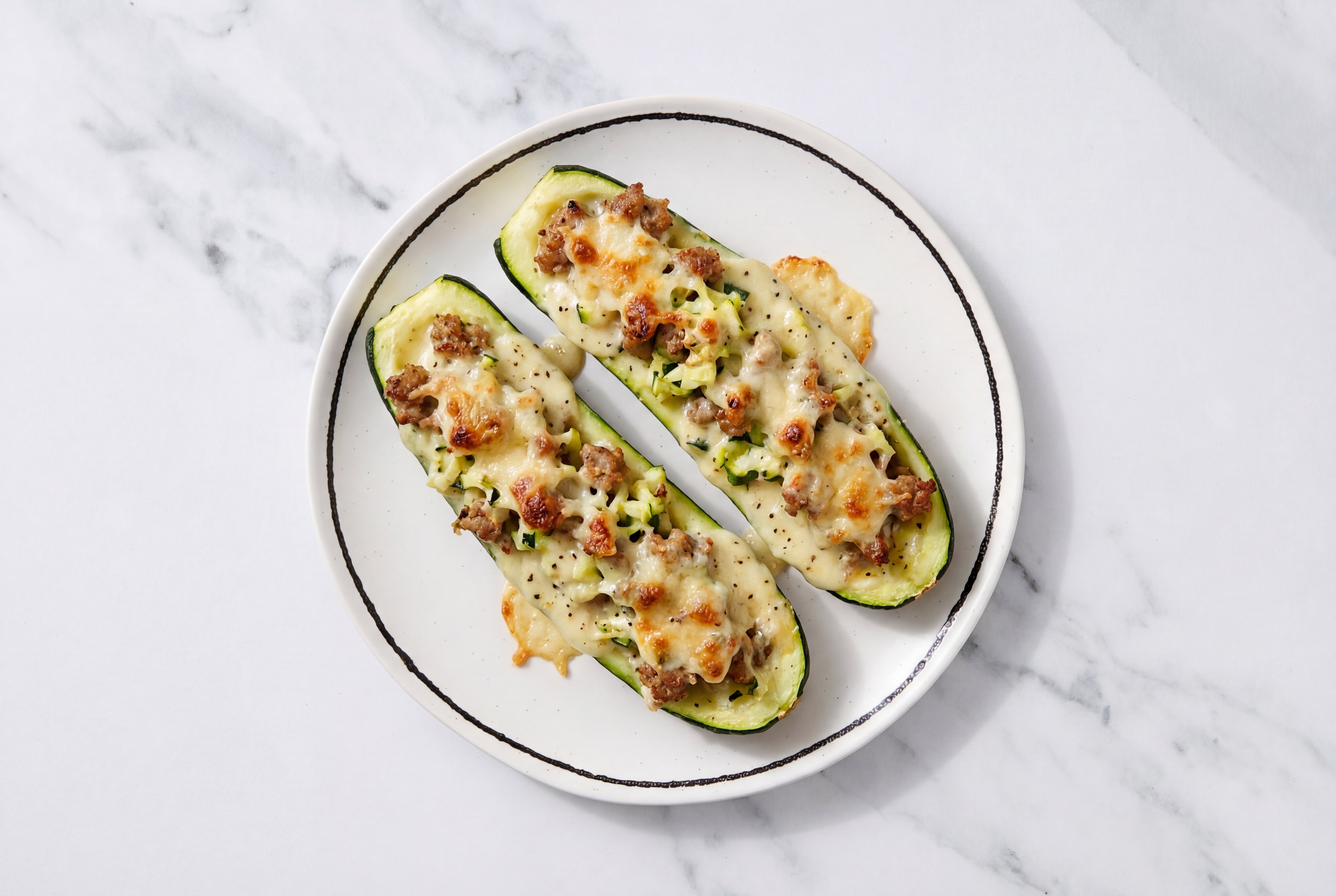 Cozy Cheesy Sweet Italian Pork Sausage Zucchini Boats