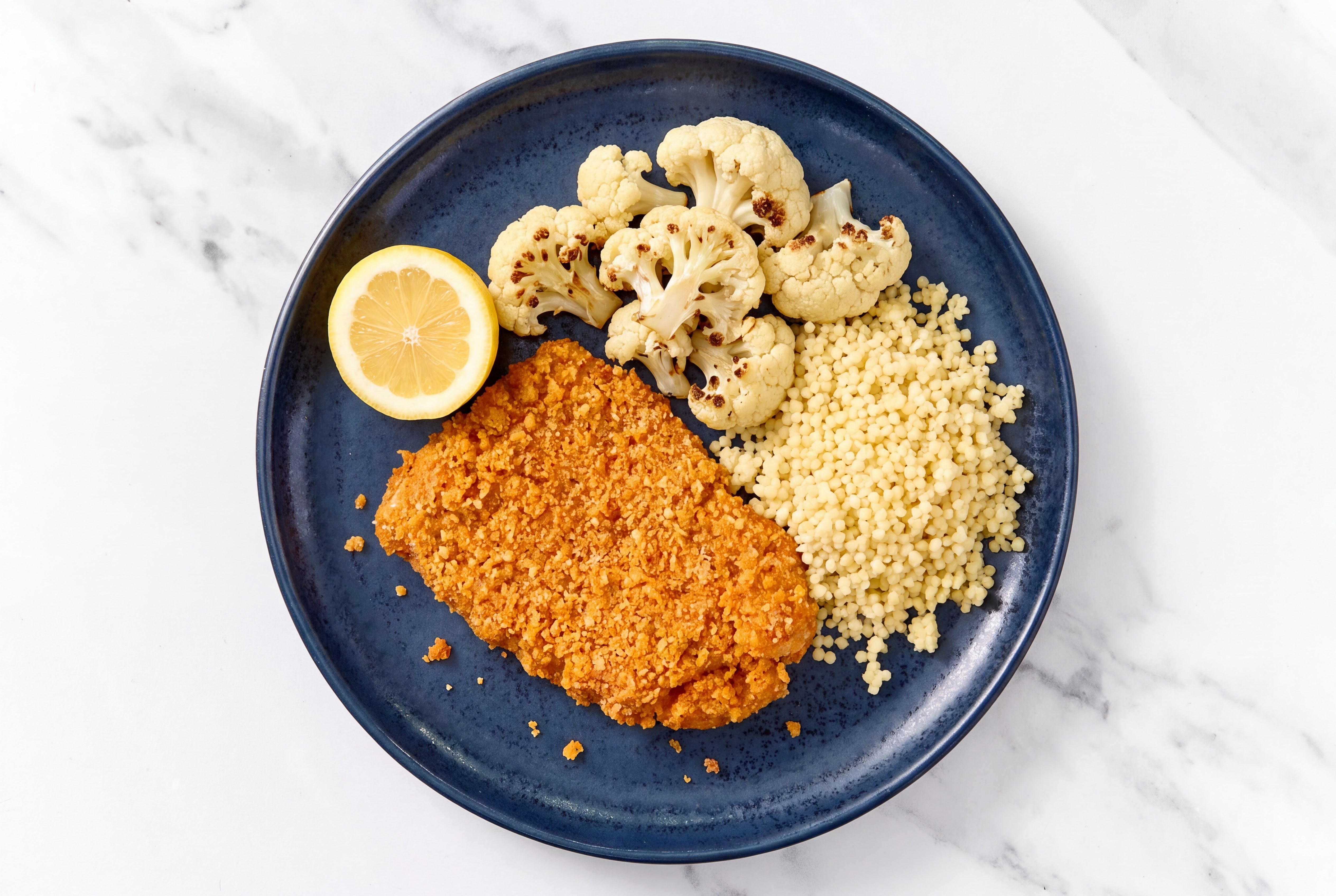 Lemon Hot Honey Breaded Chicken Cutlet with Cauliflower Florets & Couscous