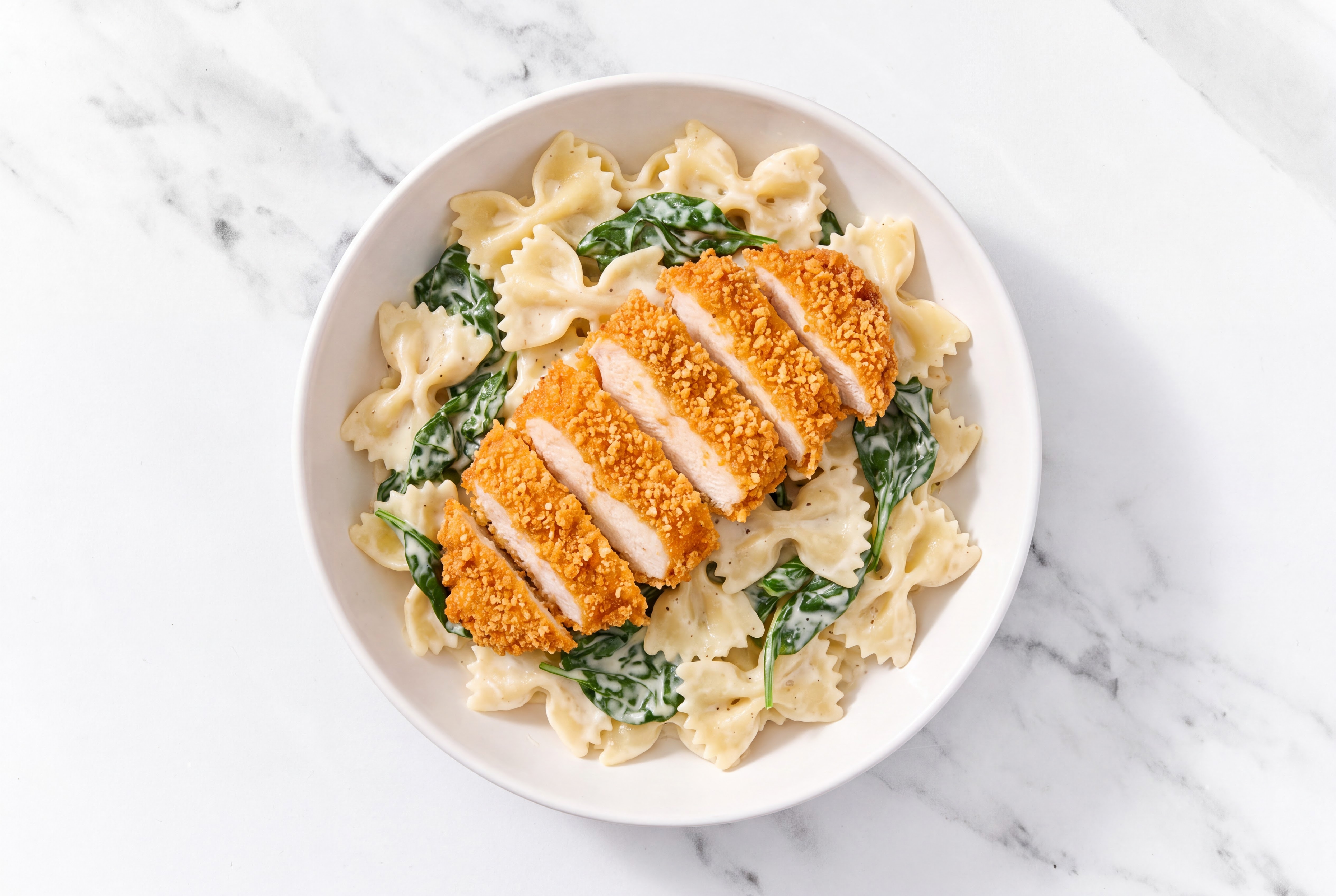 Crispy Hot Honey Chicken over Alfredo Farfalle with Baby Spinach