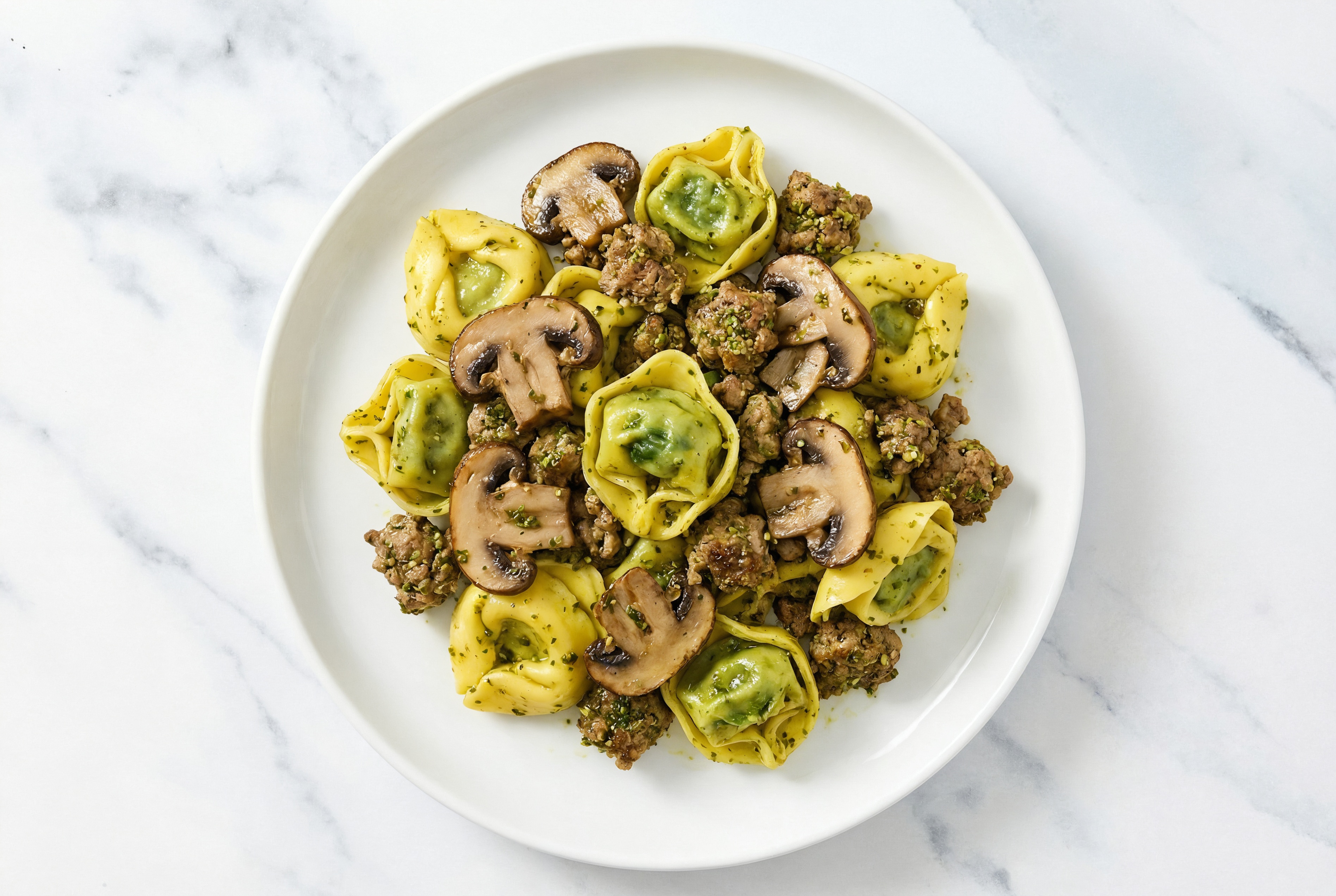 Tortelloni Pesto with Ground Bison & Mushrooms with Spinach Tortellini with Almond Milk Ricotta Alternative