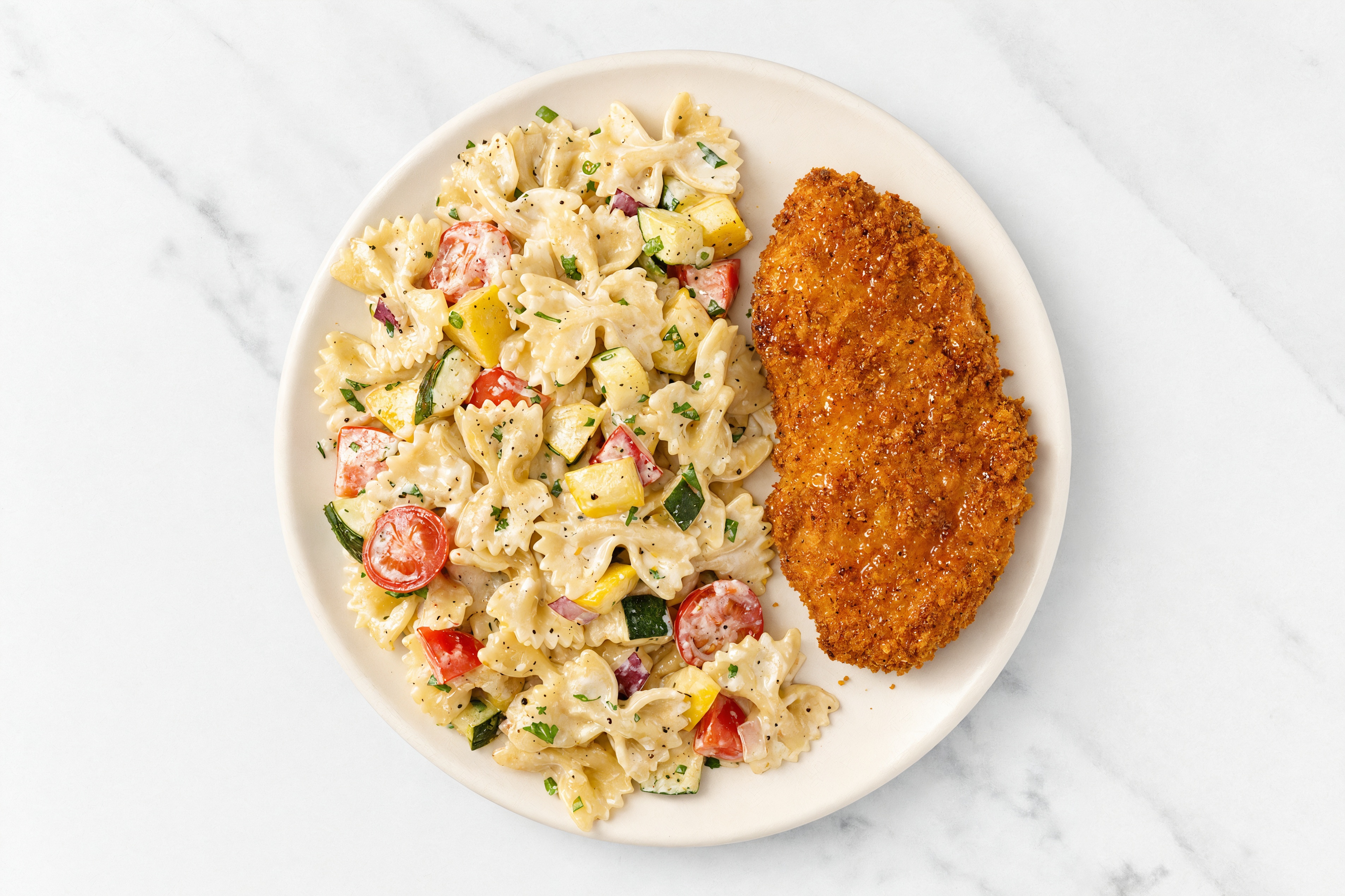 Crispy Hot Honey Chicken over Alfredo Farfalle with Mixed Veggies