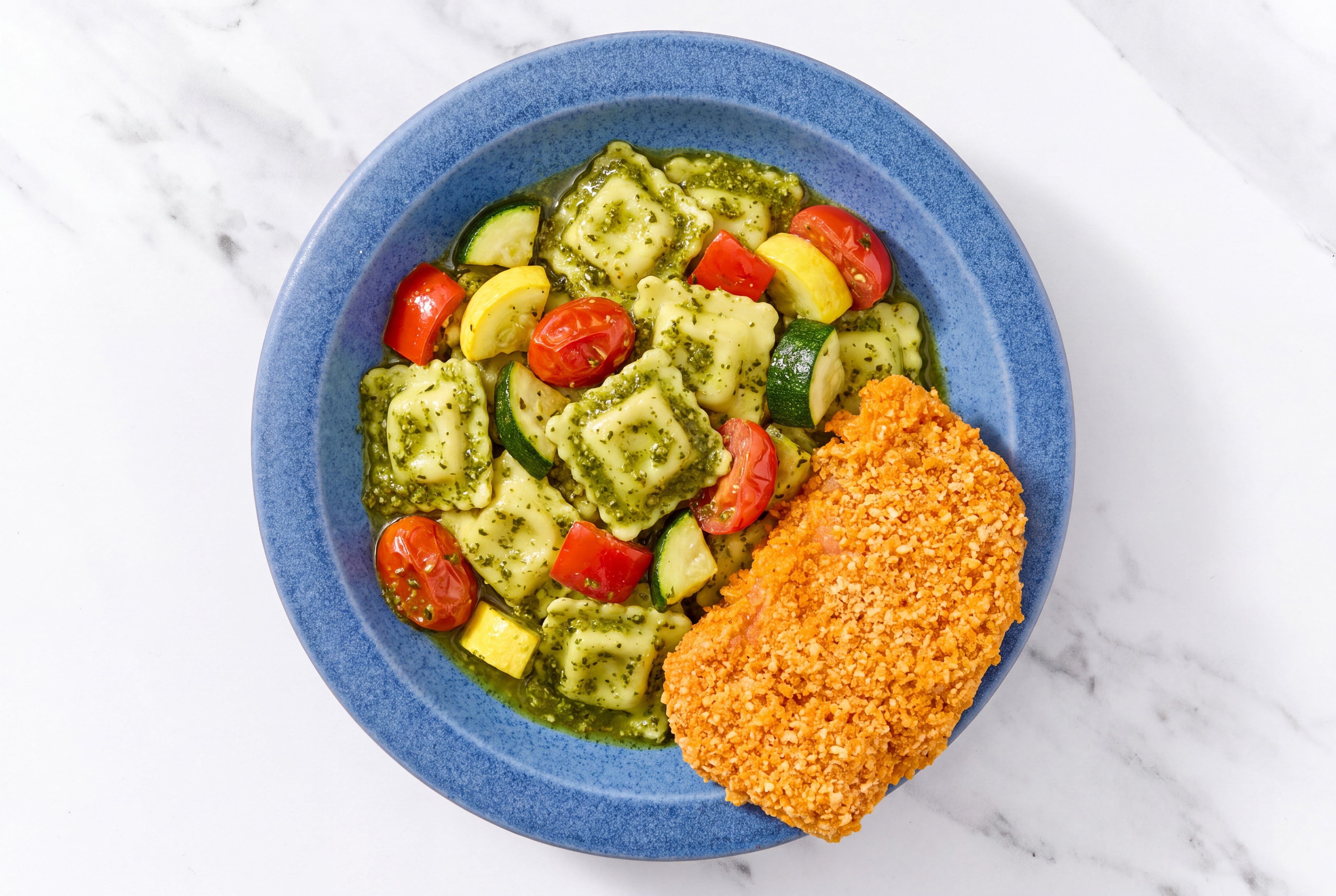 Crispy Hot Honey Chicken over Pesto Ravioli with Mixed Veggies