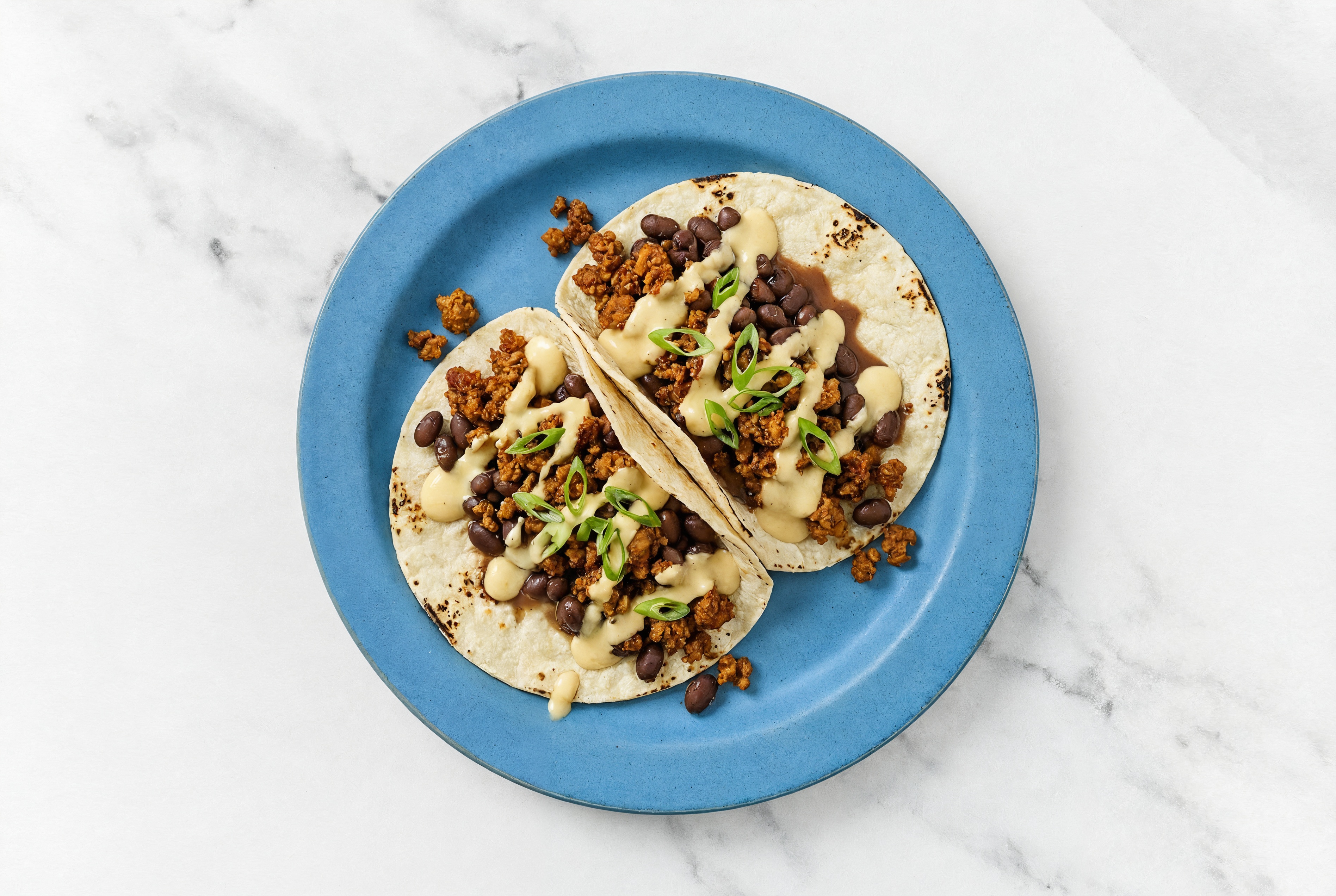 Plant-Based Chorizo Black Bean Queso Tacos