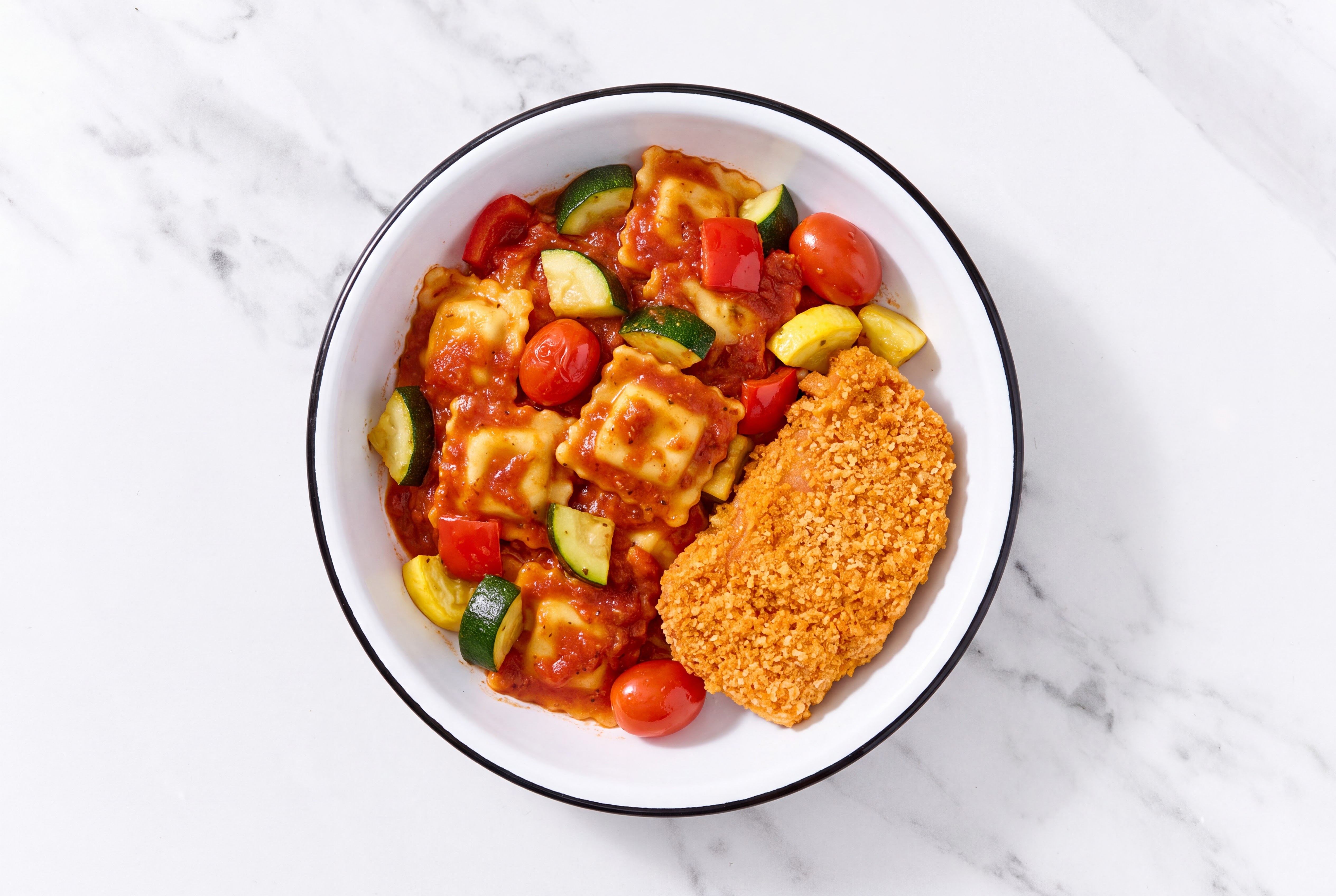 Crispy Hot Honey Chicken over Marinara Ravioli with Mixed Veggies