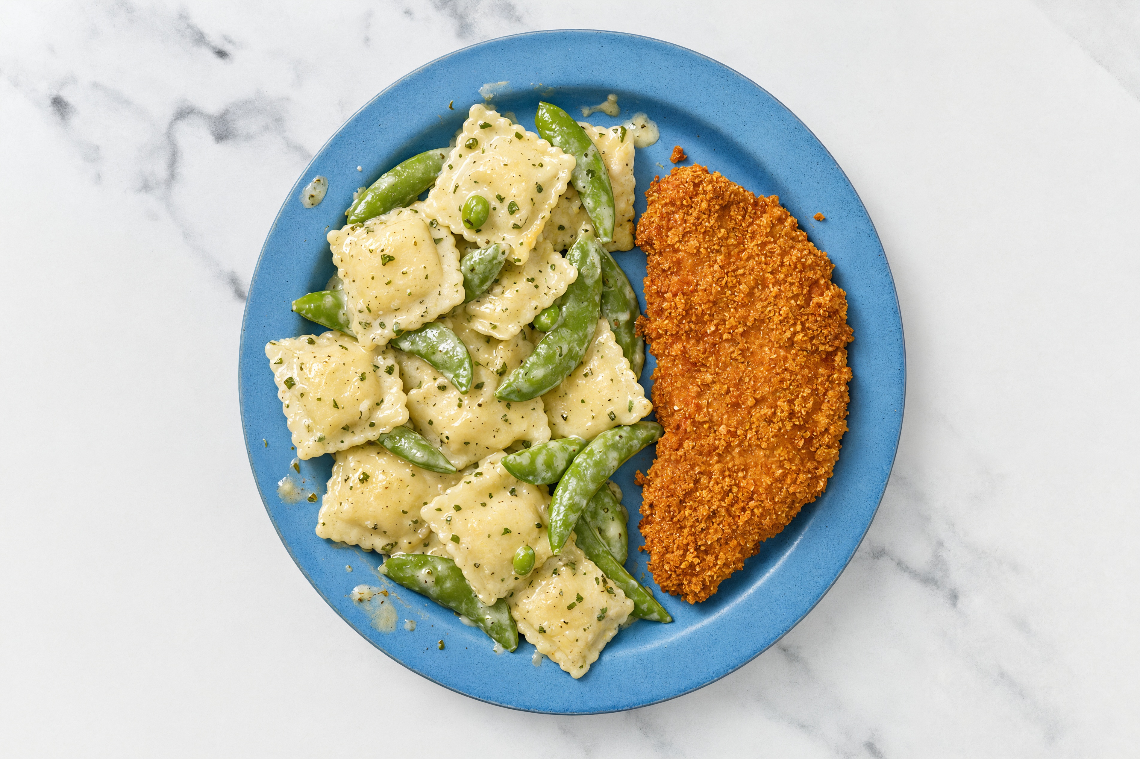 Crispy Hot Honey Chicken over Creamy Ravioli with Snap Peas