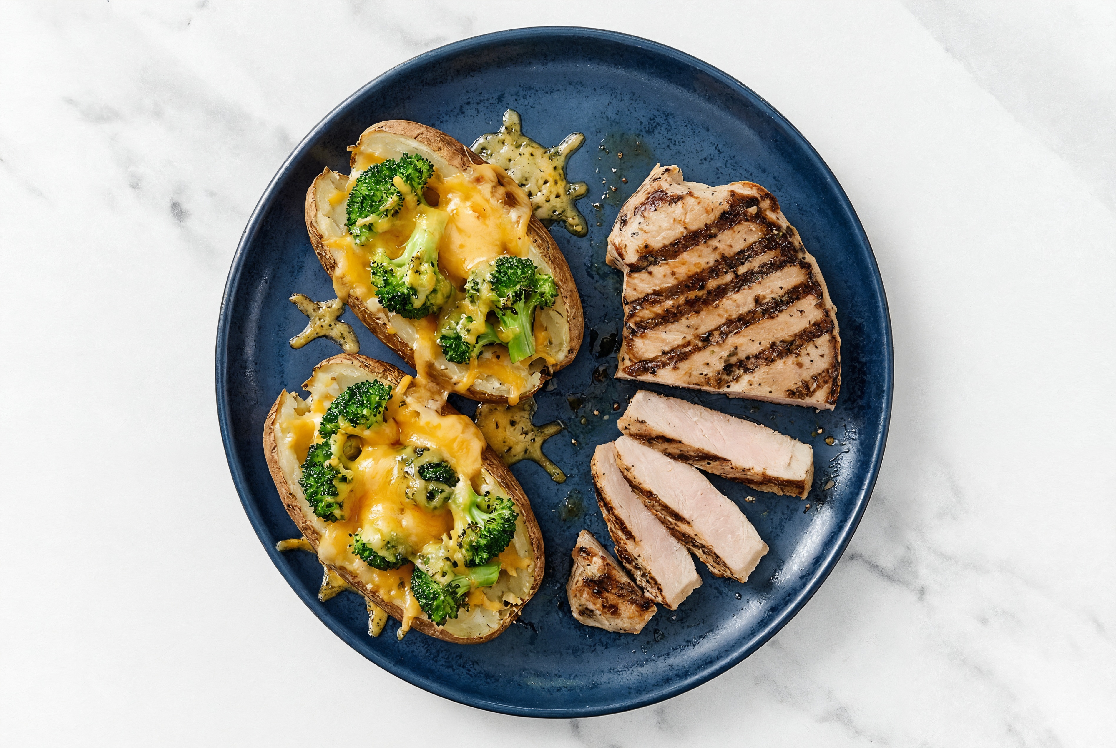 Grilled Pork Chops + Cheesy Loaded Potato with Shredded Sharp Cheddar Cheese