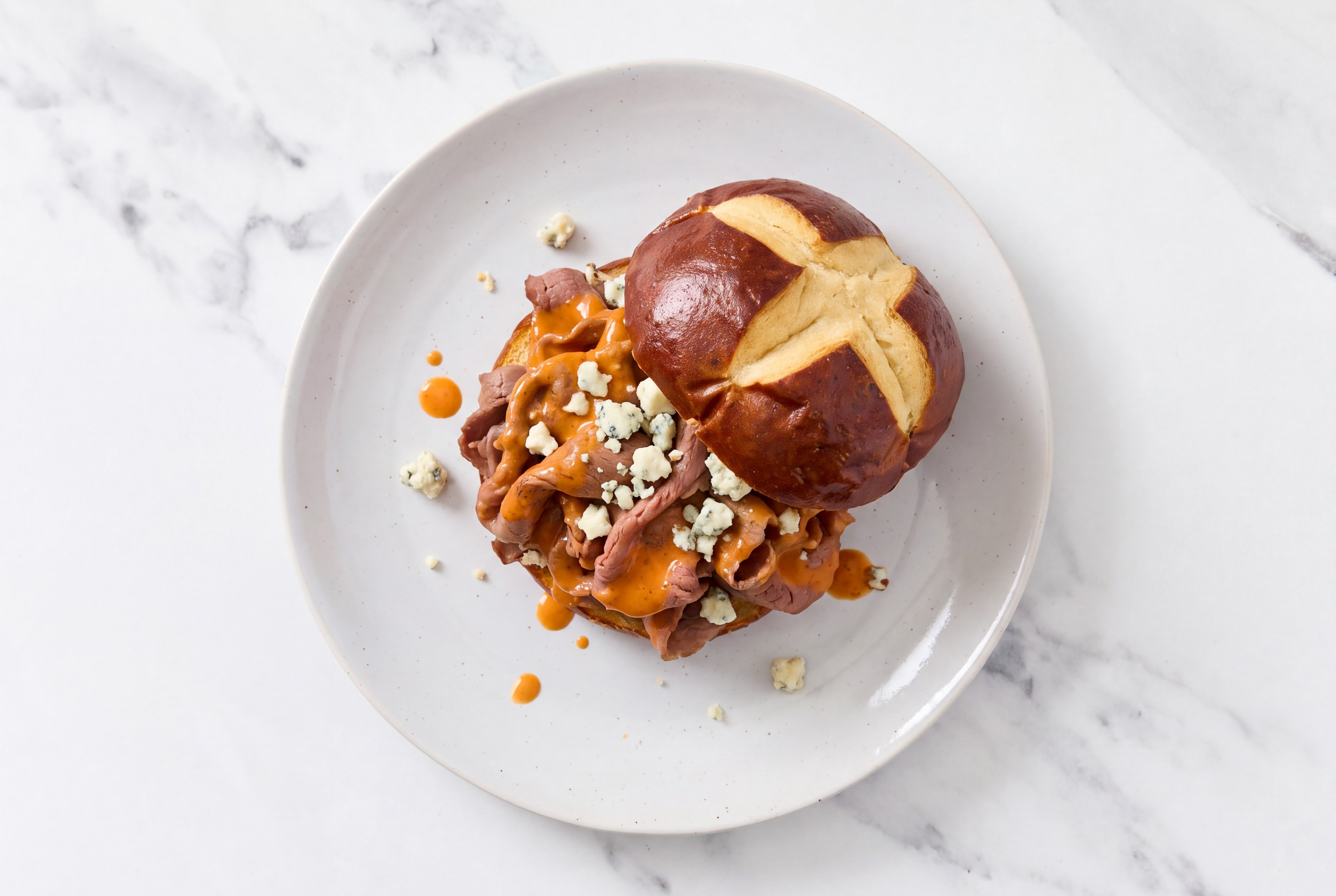 Dill Buffalo + Blue Cheese Shaved Ribeye Sandwich