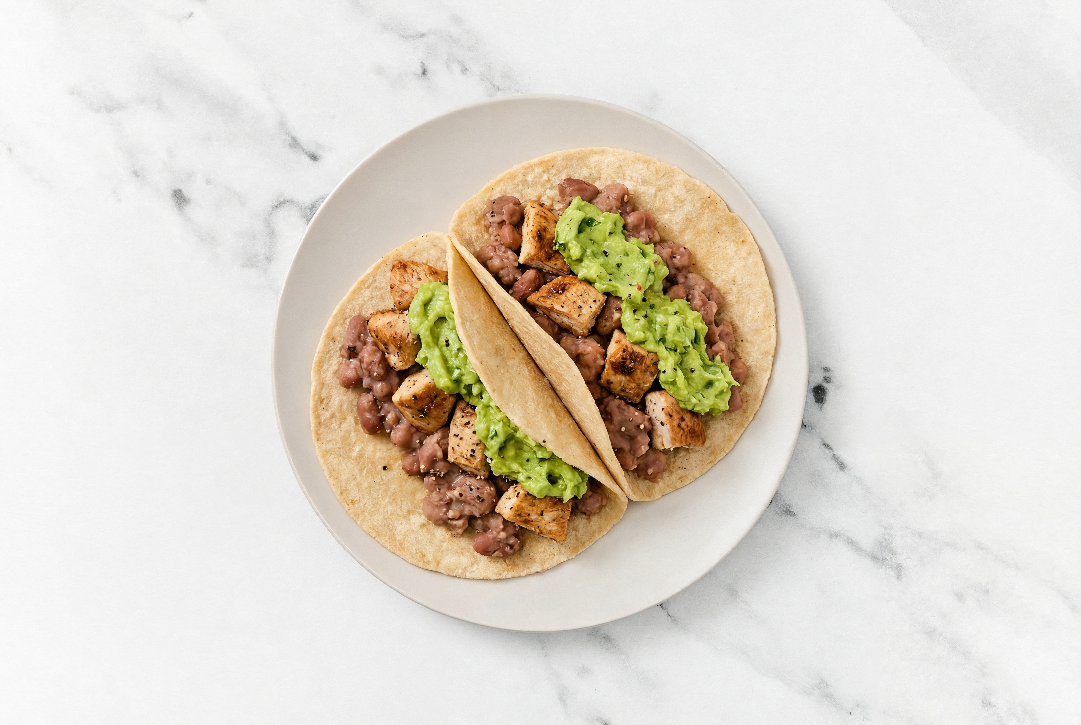 Garlic Turkey Tacos with Guacamole & Refried Red Beans