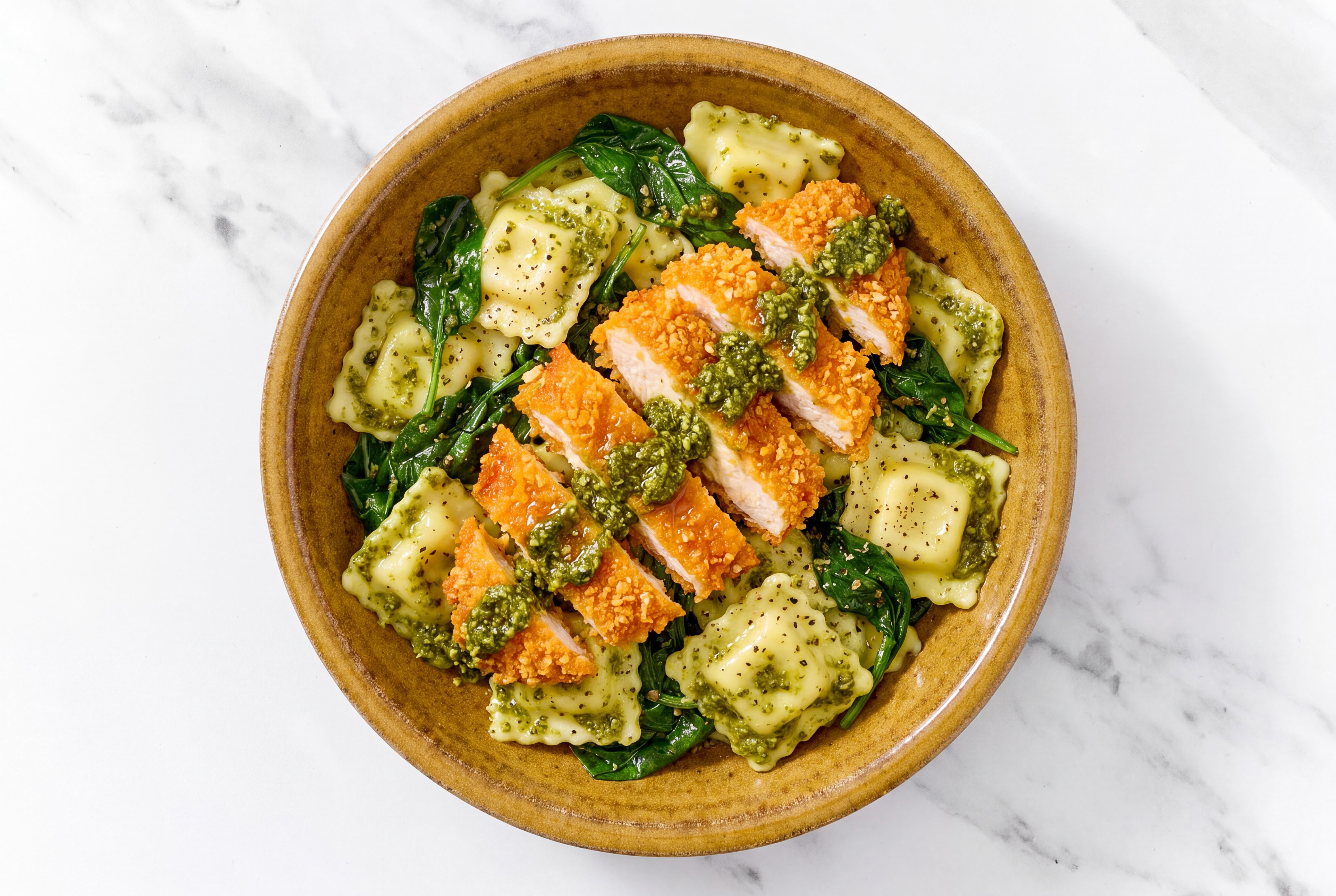 Crispy Hot Honey Chicken over Pesto Ravioli with Baby Spinach