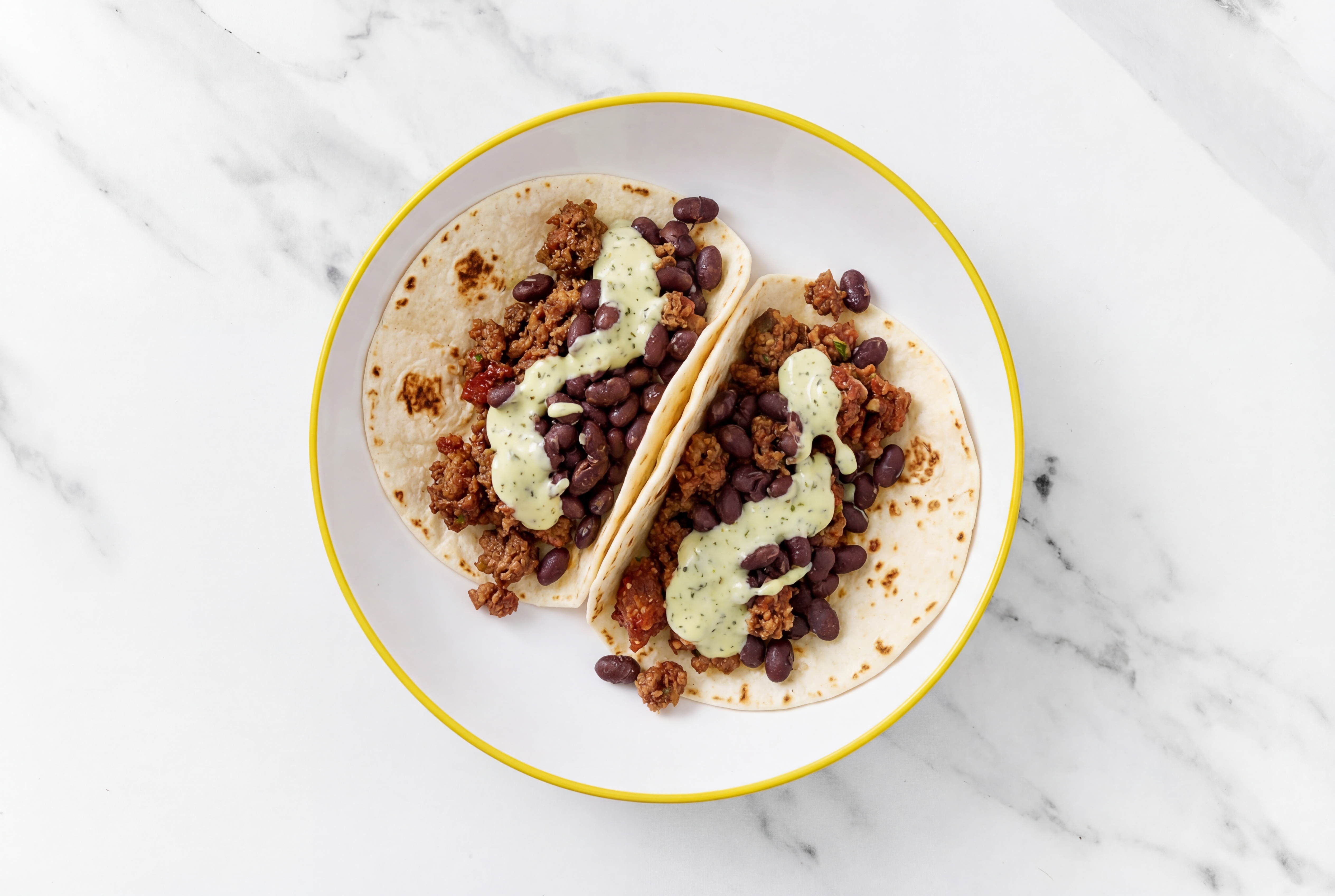  Mexican-Style Ground Beef Tacos with Jalapeño Crema & Spiced Beans