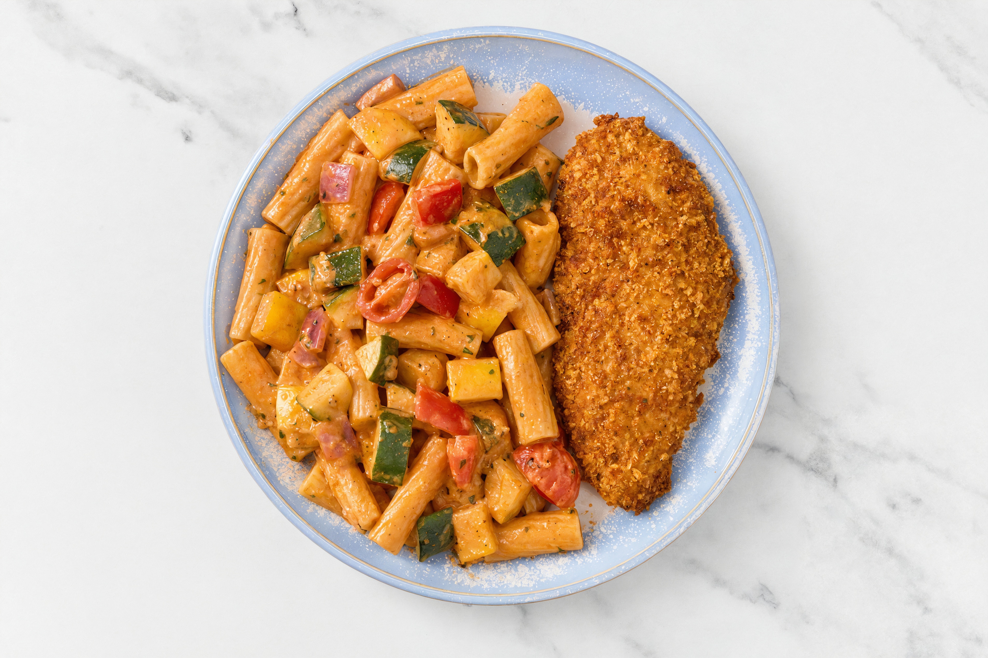 Crispy Hot Honey Chicken over Creamy Vodka Rigatoni with Mixed Veggies