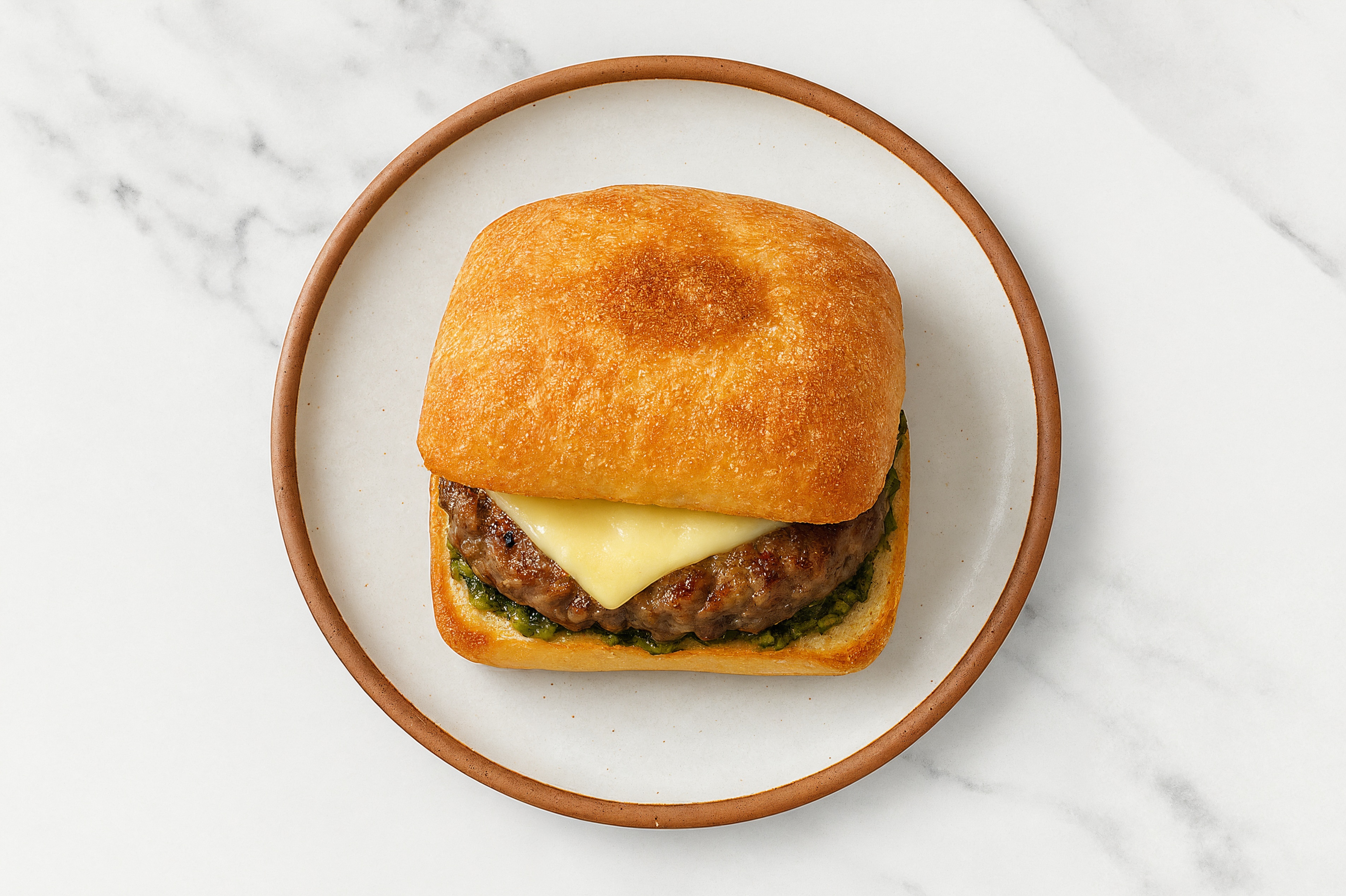 Ground Lamb Burger on Ciabatta with Spinach Pesto & Havarti
