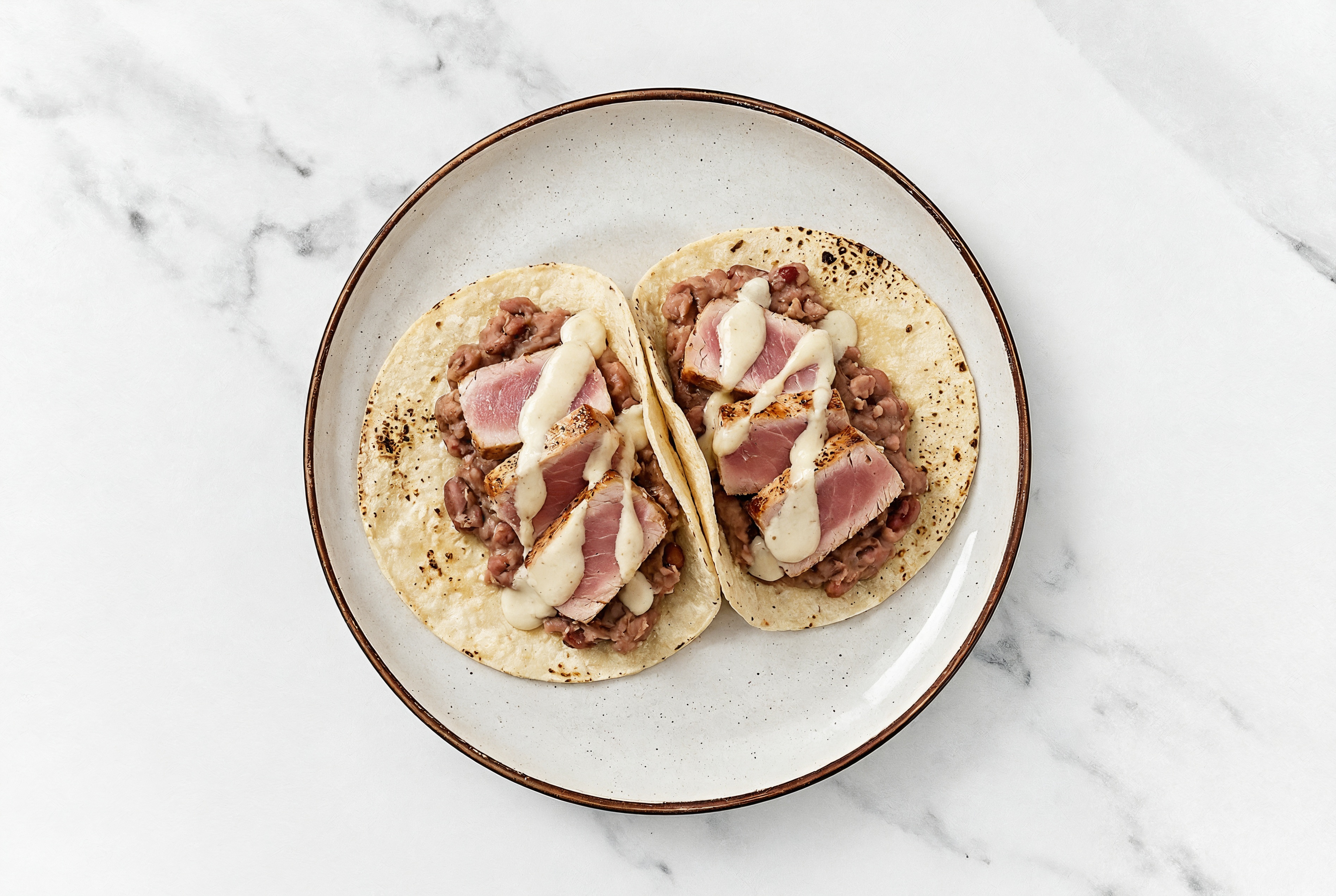 Hearty Refried Red Bean Tacos with Seared Tuna & Garlic Sauce