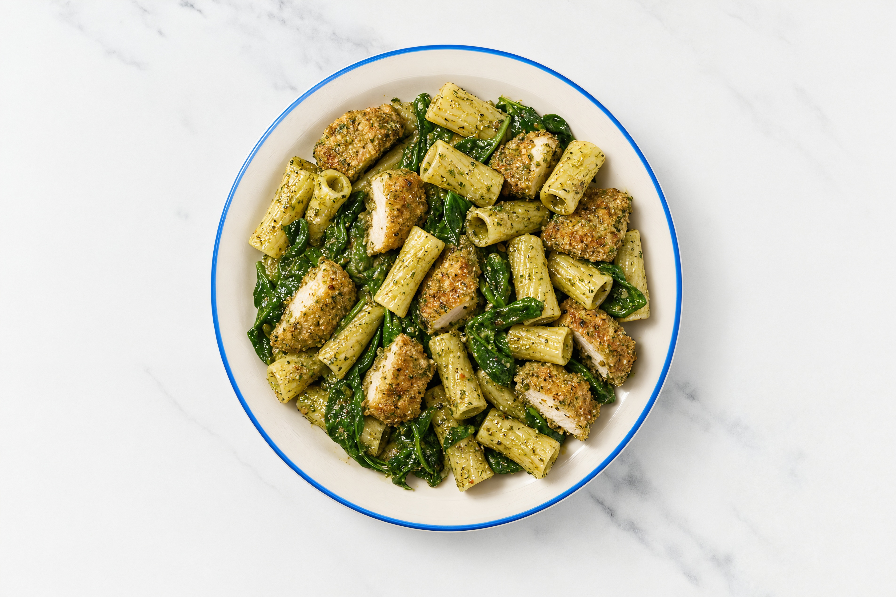Crispy Garlic Chicken over Pesto Rigatoni with Baby Spinach