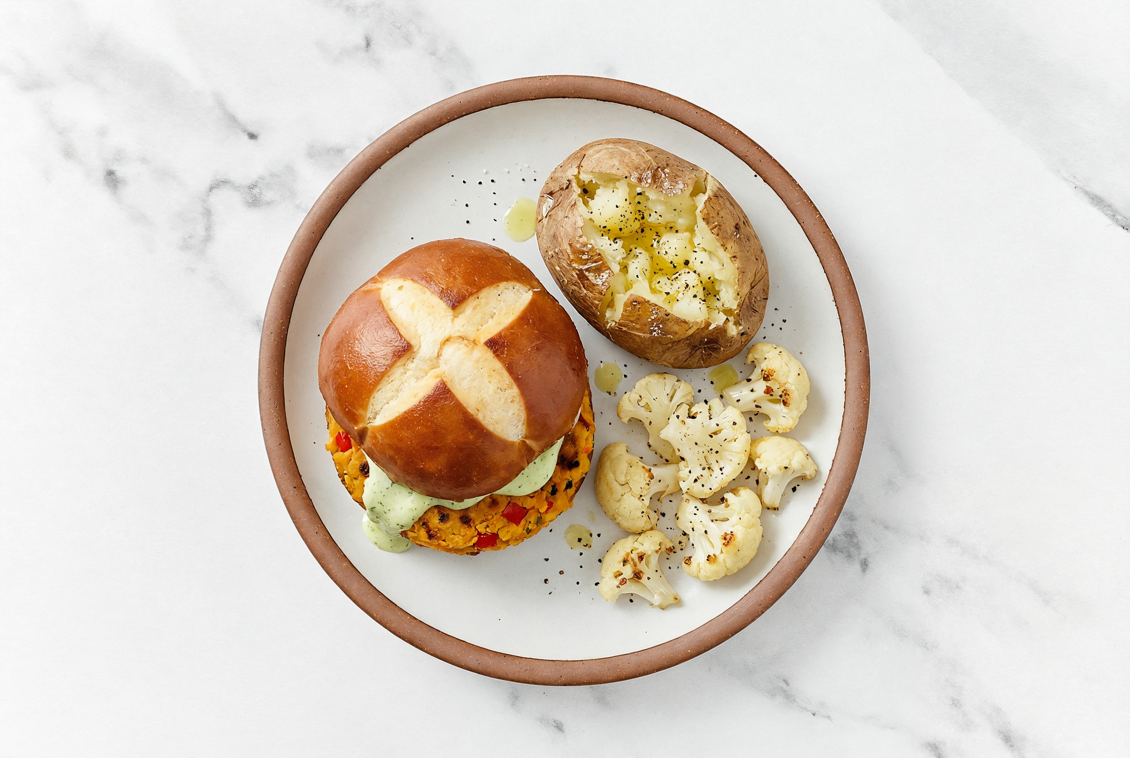 Jalapeño Sweet Potato Burger on Pretzel Bun with Cauliflower